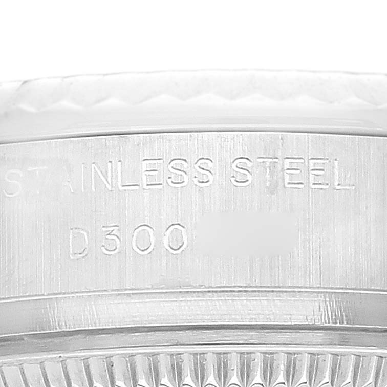 The image shows a close-up of the engraved serial number on the stainless steel caseback rim of a Rolex Datejust 179174 Women's Stainless Steel Silver Dial 179174 Women's Stainless Steel Silver Dial watch.