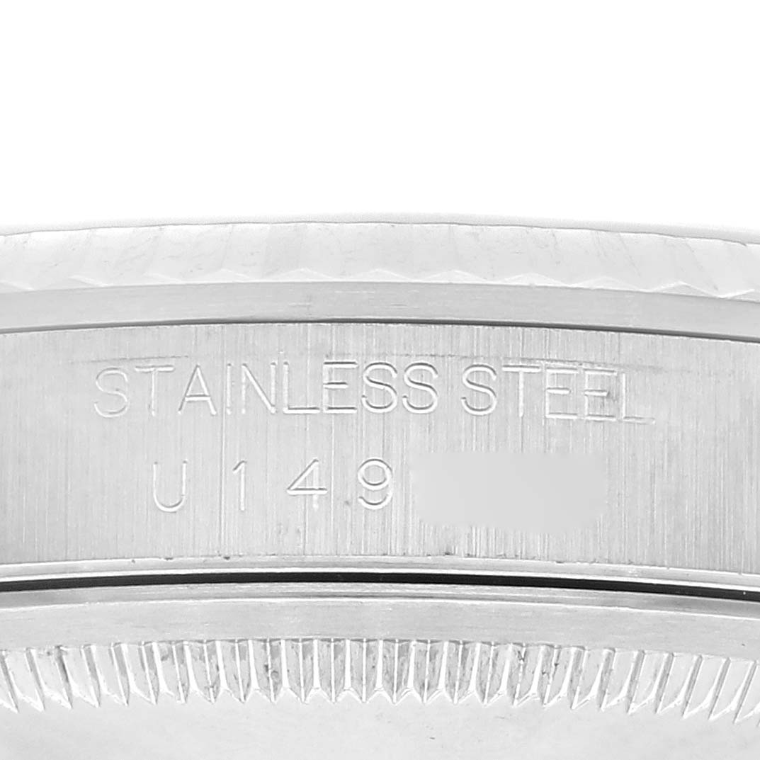 This close-up image shows the side of the bezel and the engravings on the case of a Rolex Datejust 16234 Men's Stainless Steel Silver Dial 16234 Men's Stainless Steel Silver Dial watch.