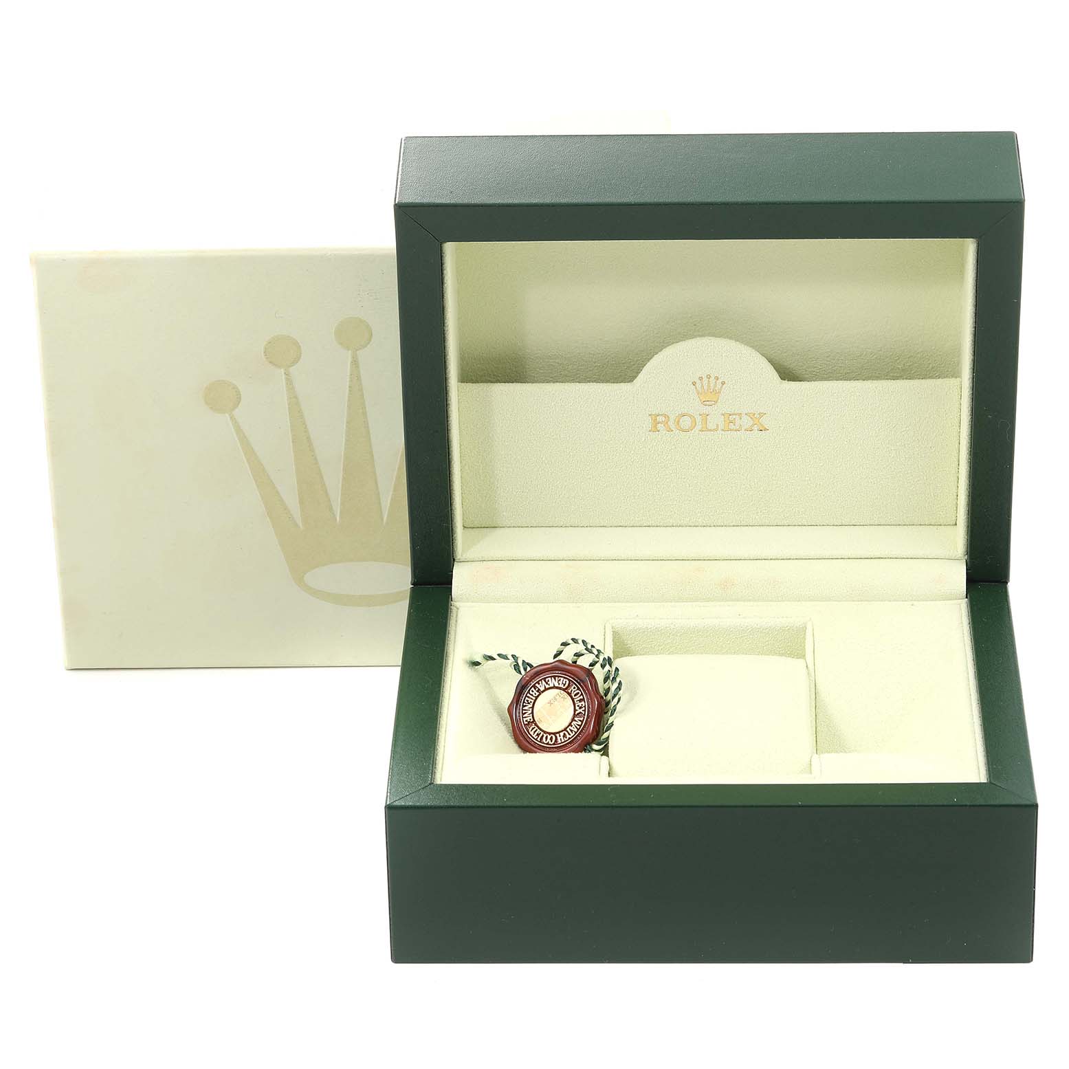 This image shows an open box for the Rolex Datejust 179173 Women's Steel and Gold (two tone) Black Dial 179173 Women's Steel and Gold (two tone) Black Dial with the green tag and cushion but no actual watch included.