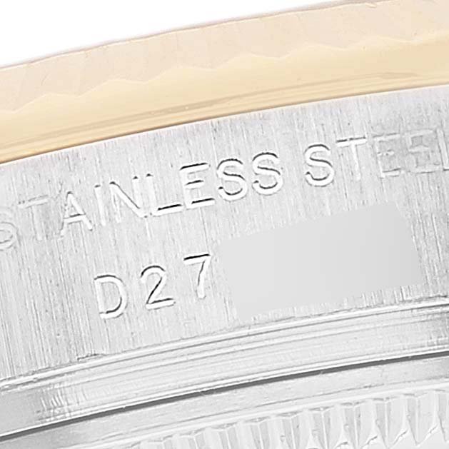 The image shows a close-up angle of the engraved inner bezel of a Rolex Datejust 179173 Women's Steel and Gold (two tone) Black Dial 179173 Women's Steel and Gold (two tone) Black Dial watch, highlighting the "STAINLESS STEEL" and partial serial number.