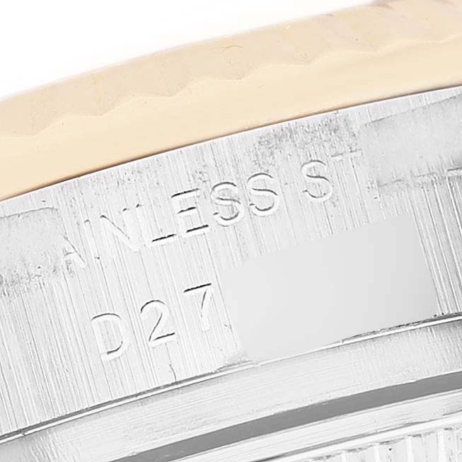 The image displays a close-up of the side of a Rolex Datejust 179173 Women's Steel and Gold (two tone) Champagne Dial 179173 Women's Steel and Gold (two tone) Champagne Dial watch, highlighting its engraved stainless steel marking.