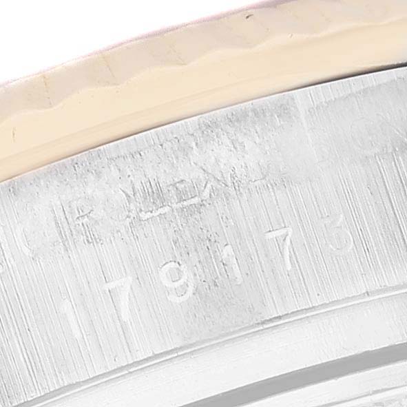 This is a close-up view of the case side and bezel of a Rolex Datejust 179173 Women's Steel and Gold (two tone) Champagne Dial 179173 Women's Steel and Gold (two tone) Champagne Dial watch, showing the engraved reference number.