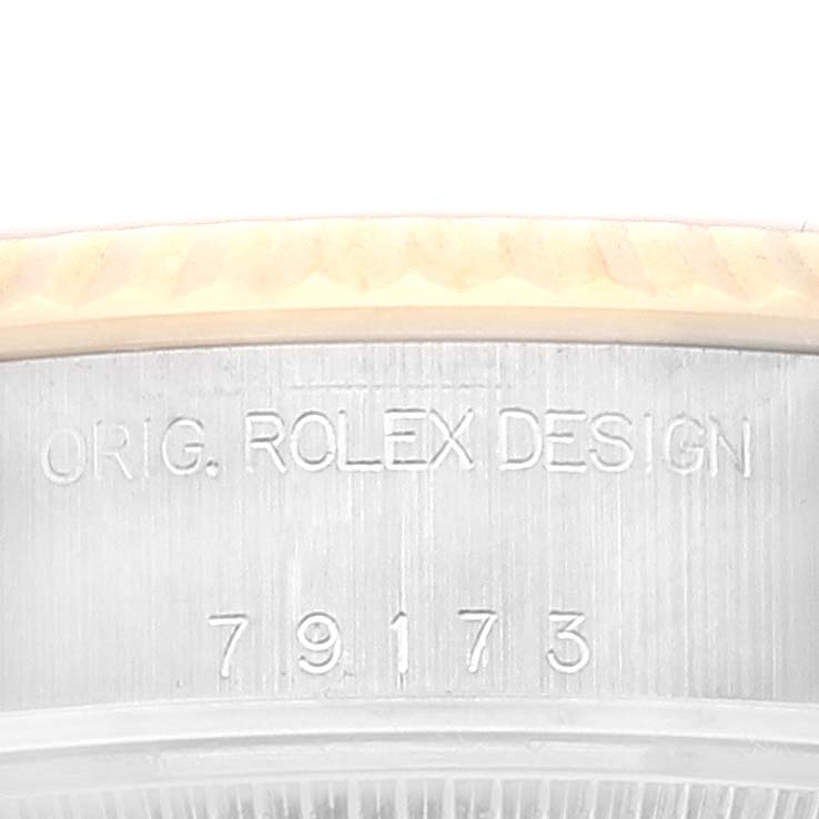 This image shows a close-up of the case side of a Rolex Datejust 79173 Women's Steel and Gold (two tone) Mother of Pearl Dial 79173 Women's Steel and Gold (two tone) Mother of Pearl Dial watch, displaying "ORIG. ROLEX DESIGN" and the model number 79173.