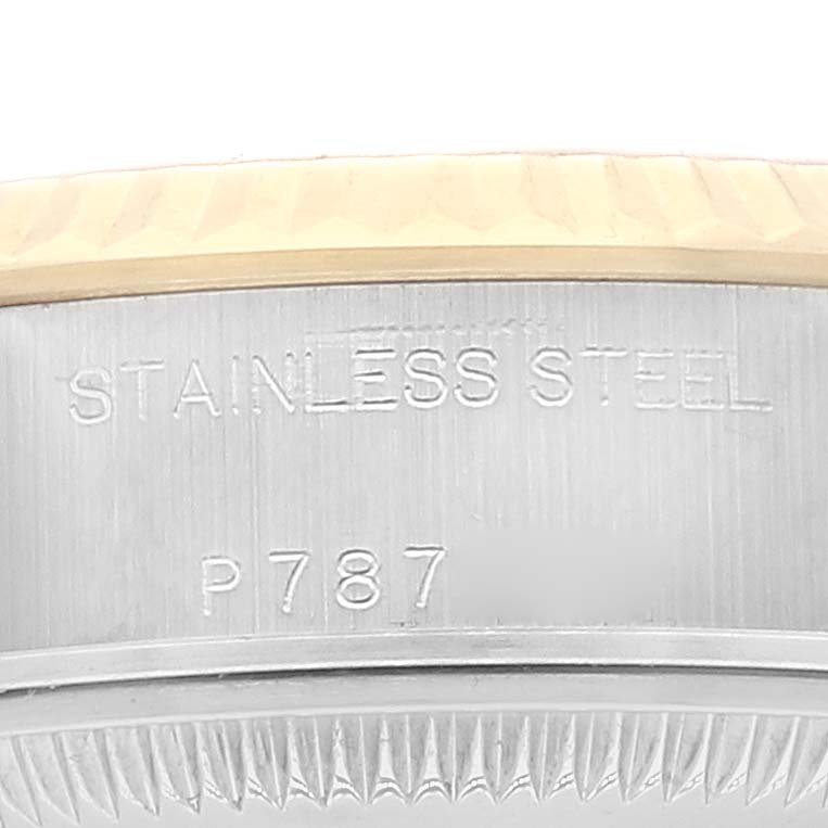 This close-up image shows the side engraving on the stainless steel case back of a Rolex Datejust 79173 Women's Steel and Gold (two tone) Mother of Pearl Dial 79173 Women's Steel and Gold (two tone) Mother of Pearl Dial watch.