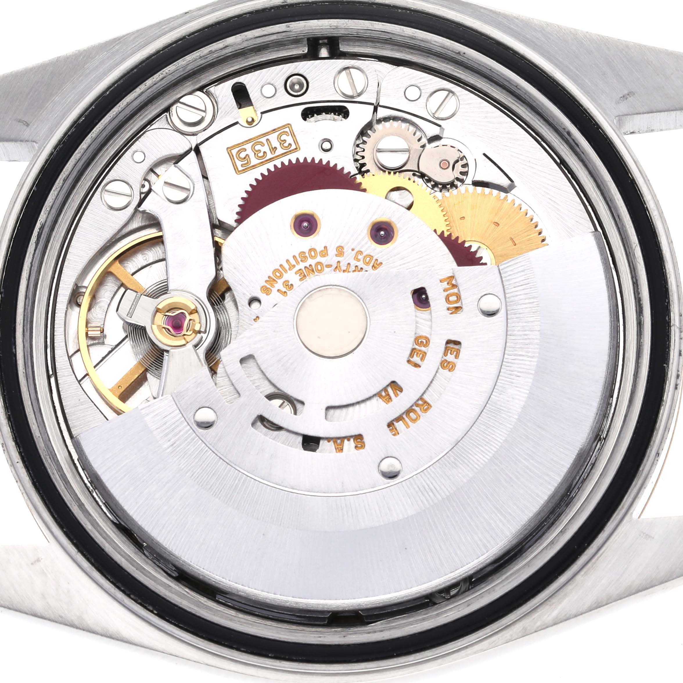The image shows the movement of a Rolex Datejust 16233 Men's Steel and Gold (two tone) Champagne Dial 16233 Men's Steel and Gold (two tone) Champagne Dial watch viewed from the back, revealing gears and mechanical components.