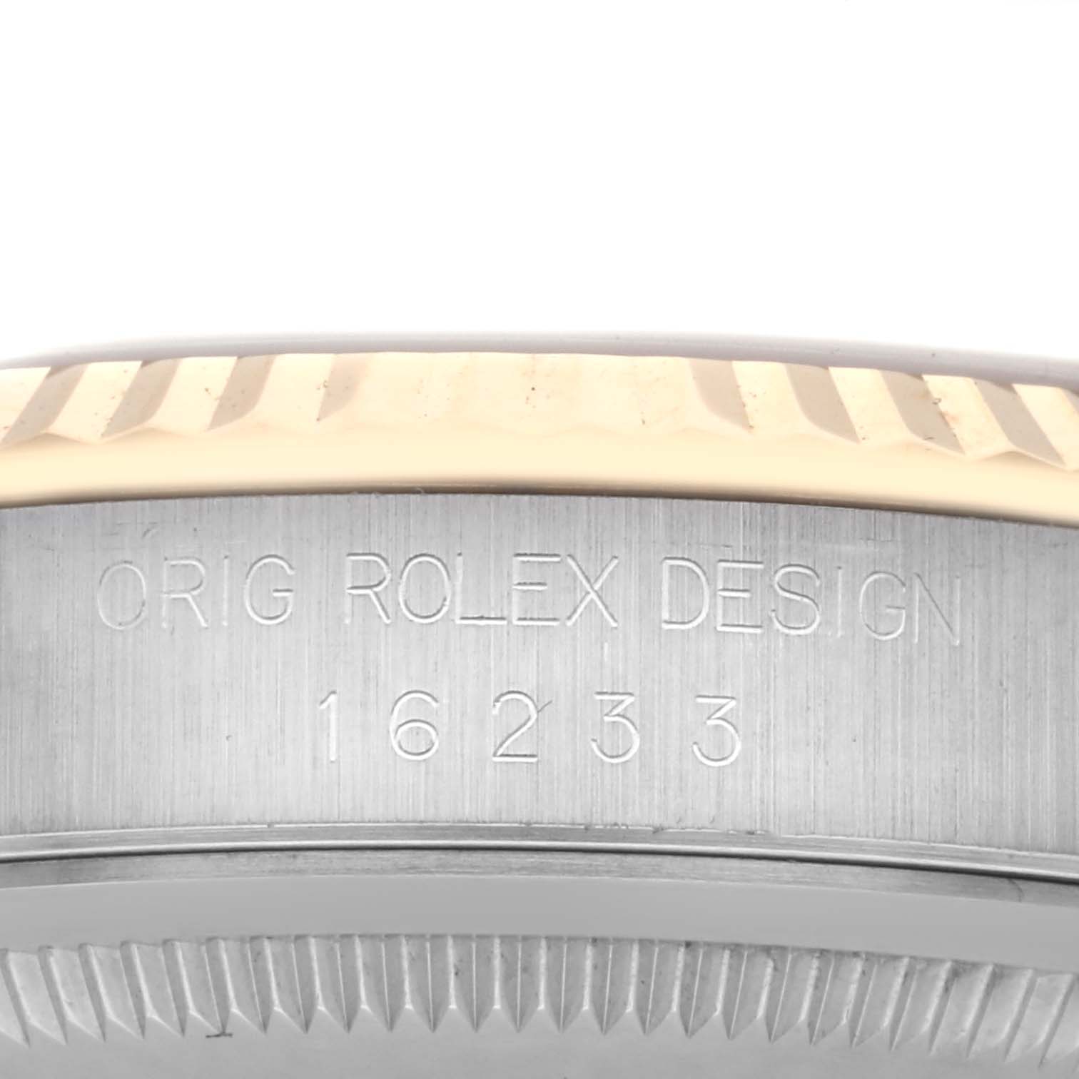 This image shows a close-up of the case side of a Rolex Datejust 16233 Men's Steel and Gold (two tone) Champagne Dial 16233 Men's Steel and Gold (two tone) Champagne Dial, highlighting the model engraving.