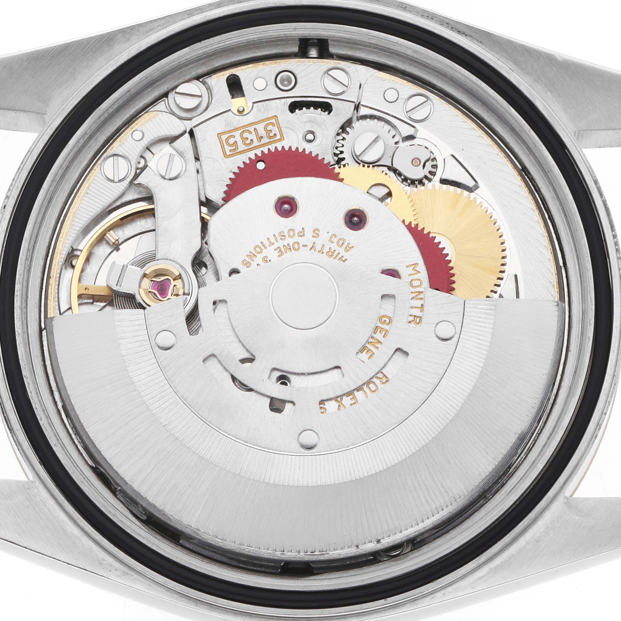 The image shows the movement mechanism of a Rolex Datejust 16233 Men's Steel and Gold (two tone) Beige Dial watch from the back, displaying gears and components.
