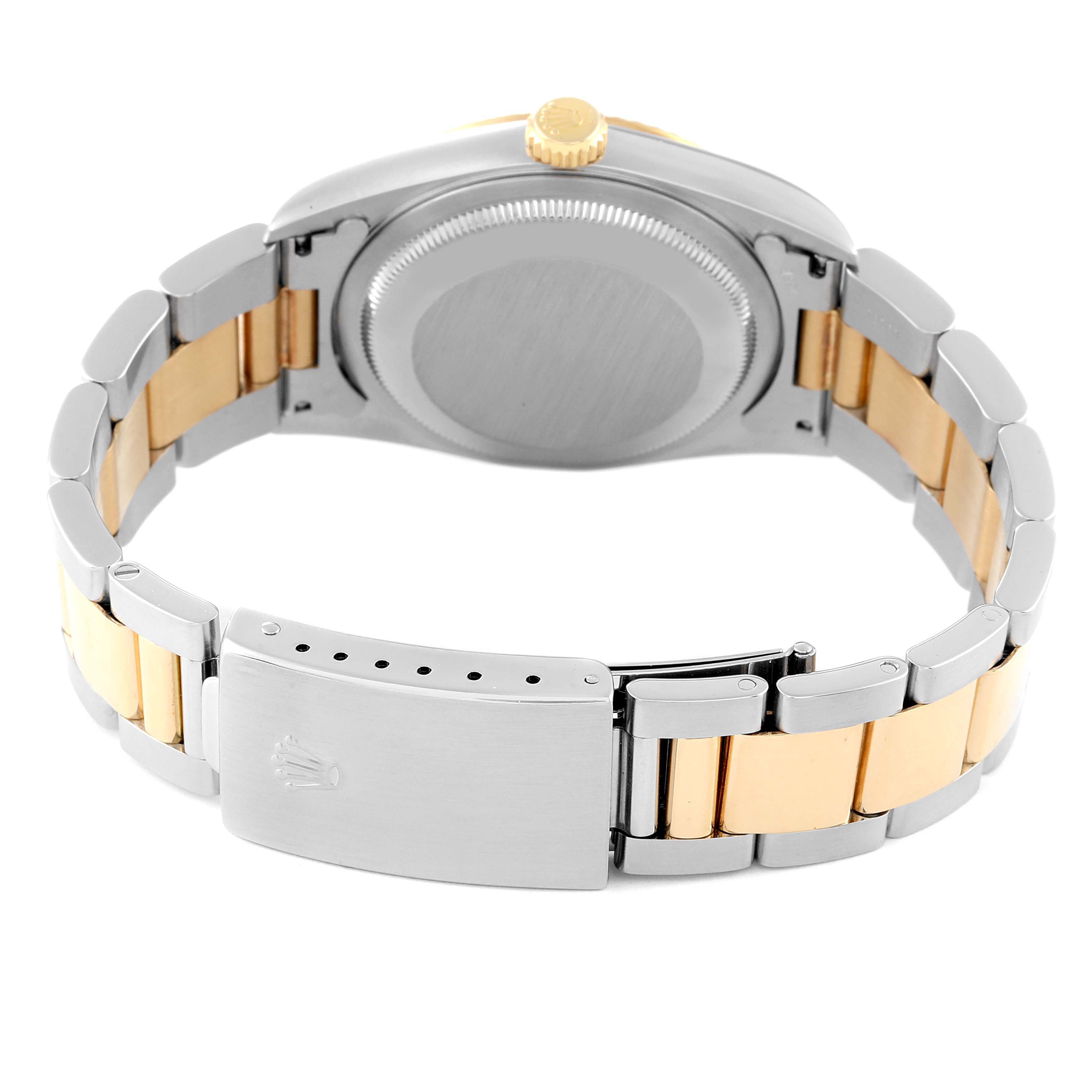 This image shows the back and clasp of a Rolex Datejust 16233 Men's Steel and Gold (two tone) Silver Dial 16233 Men's Steel and Gold (two tone) Silver Dial watch, highlighting its two-tone bracelet and case.