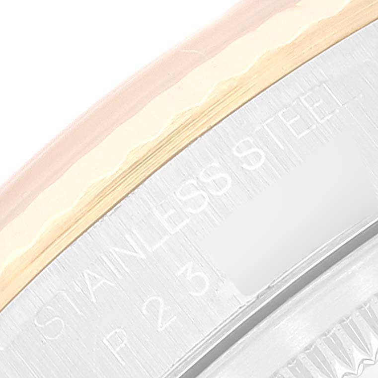 This close-up image shows an inscription of "STAINLESS STEEL" on the case back of the Rolex Datejust 16233 Men's Steel and Gold (two tone) Silver Dial 16233 Men's Steel and Gold (two tone) Silver Dial model.