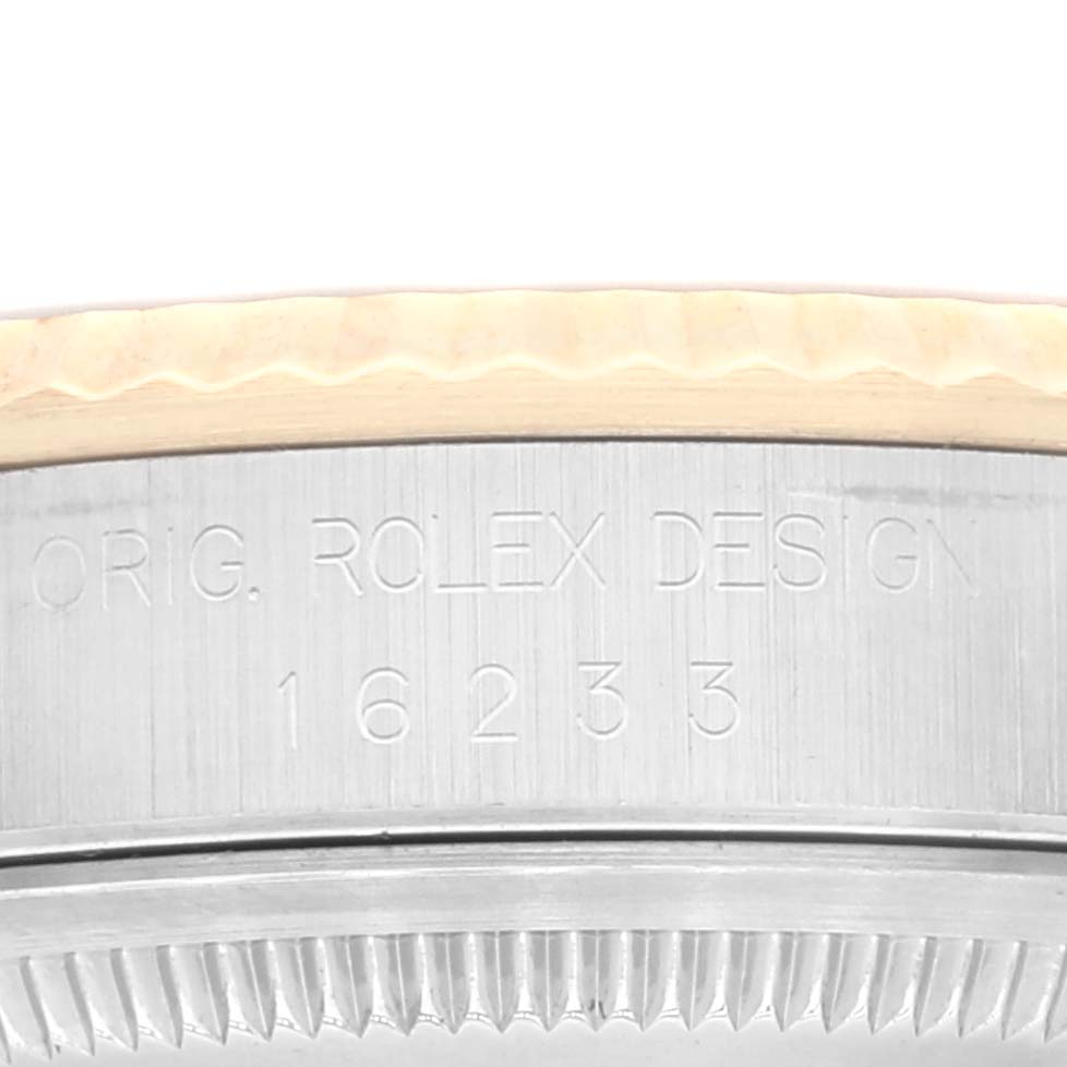This image shows a close-up of the side of a Rolex Datejust 16233 Men's Steel and Gold (two tone) White Dial 16233 Men's Steel and Gold (two tone) White Dial watch, highlighting the model number 16233.