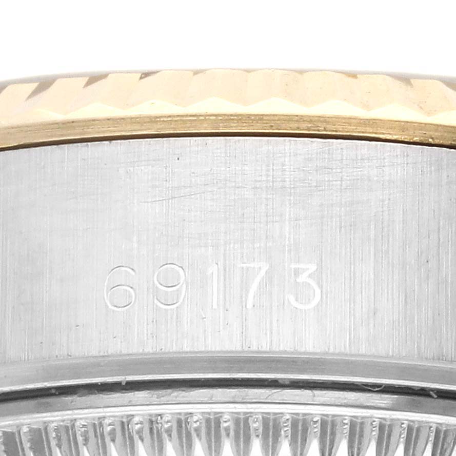 The image shows the side of a Rolex Datejust 69173 Women's Steel and Gold (two tone) White Dial 69173 Women's Steel and Gold (two tone) White Dial watch, highlighting the case and part of the bezel with the model number 69173.