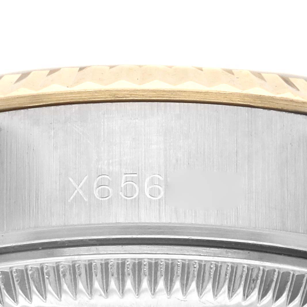 The image shows a close-up of the side casing and fluted bezel details of the Rolex Datejust 69173 Women's Steel and Gold (two tone) White Dial 69173 Women's Steel and Gold (two tone) White Dial watch.