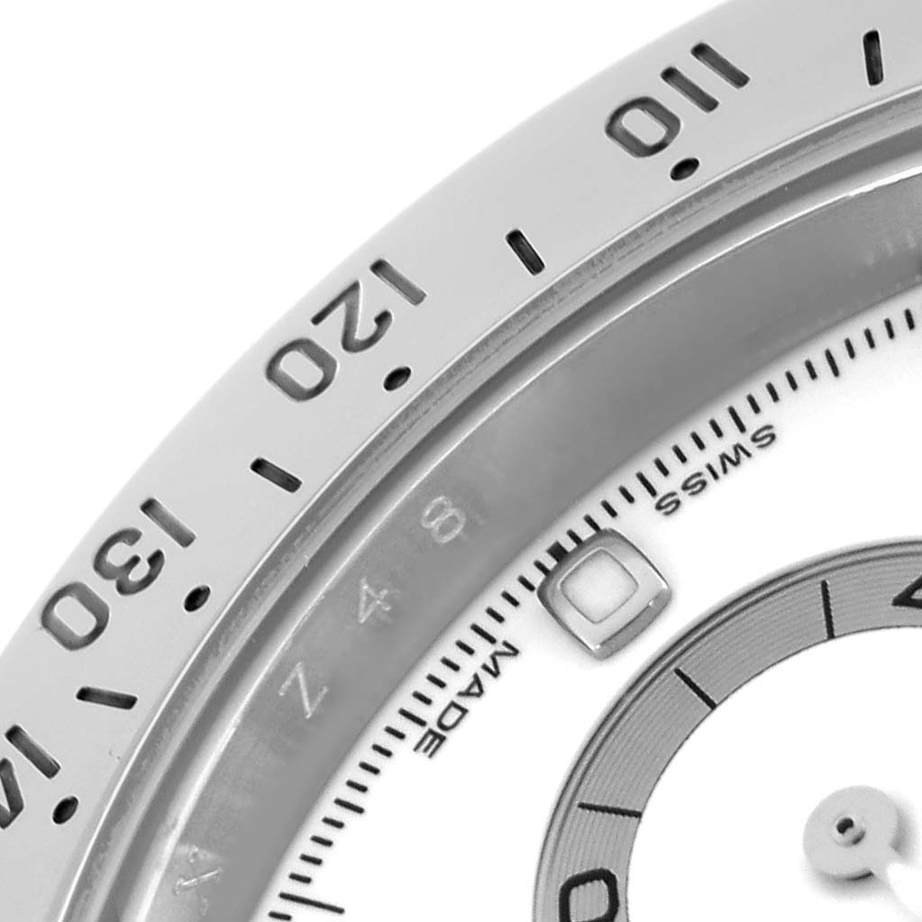 The close-up shows the bezel, partial dial, and sub-dial of a Rolex Daytona 116520 Men
s Stainless Steel White Dial 116520 Men
s Stainless Steel White Dial watch, focusing on numbers and markings.