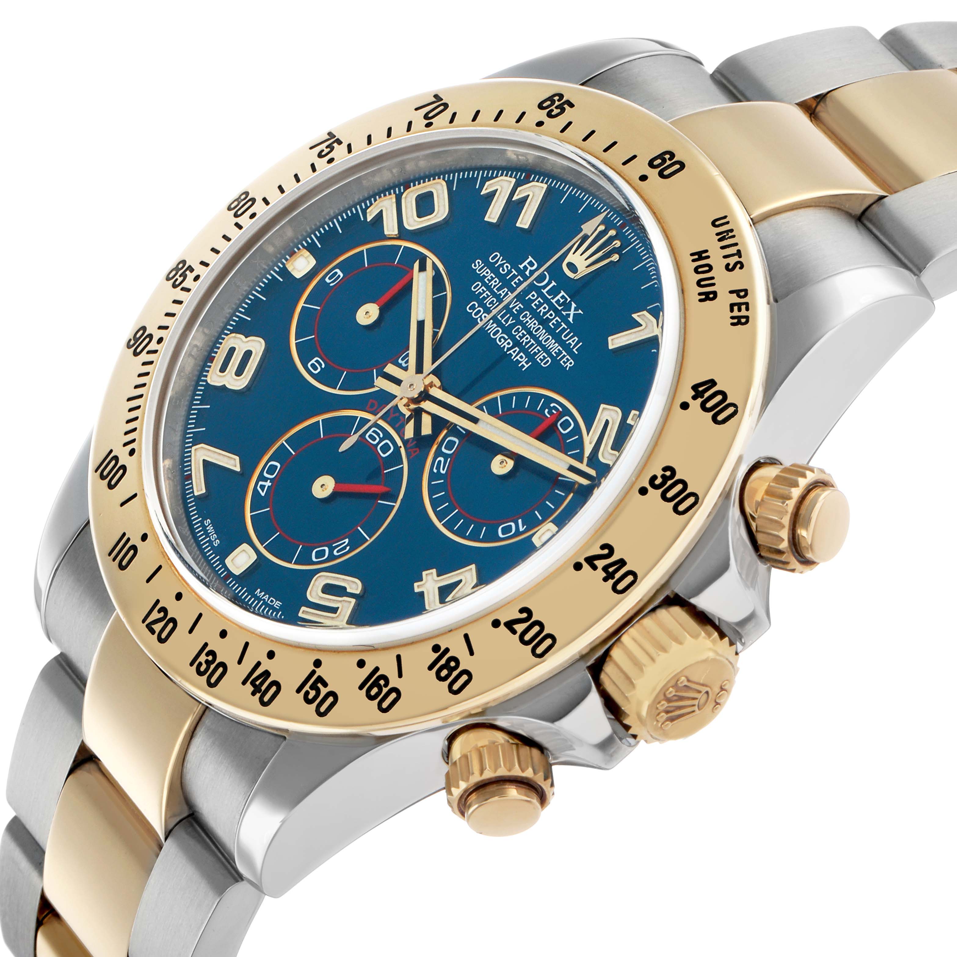 The Rolex Daytona 116523 Men's Steel and Gold (two tone) Blue Dial watch is shown at an oblique angle, highlighting the bezel, dial, and pushers.