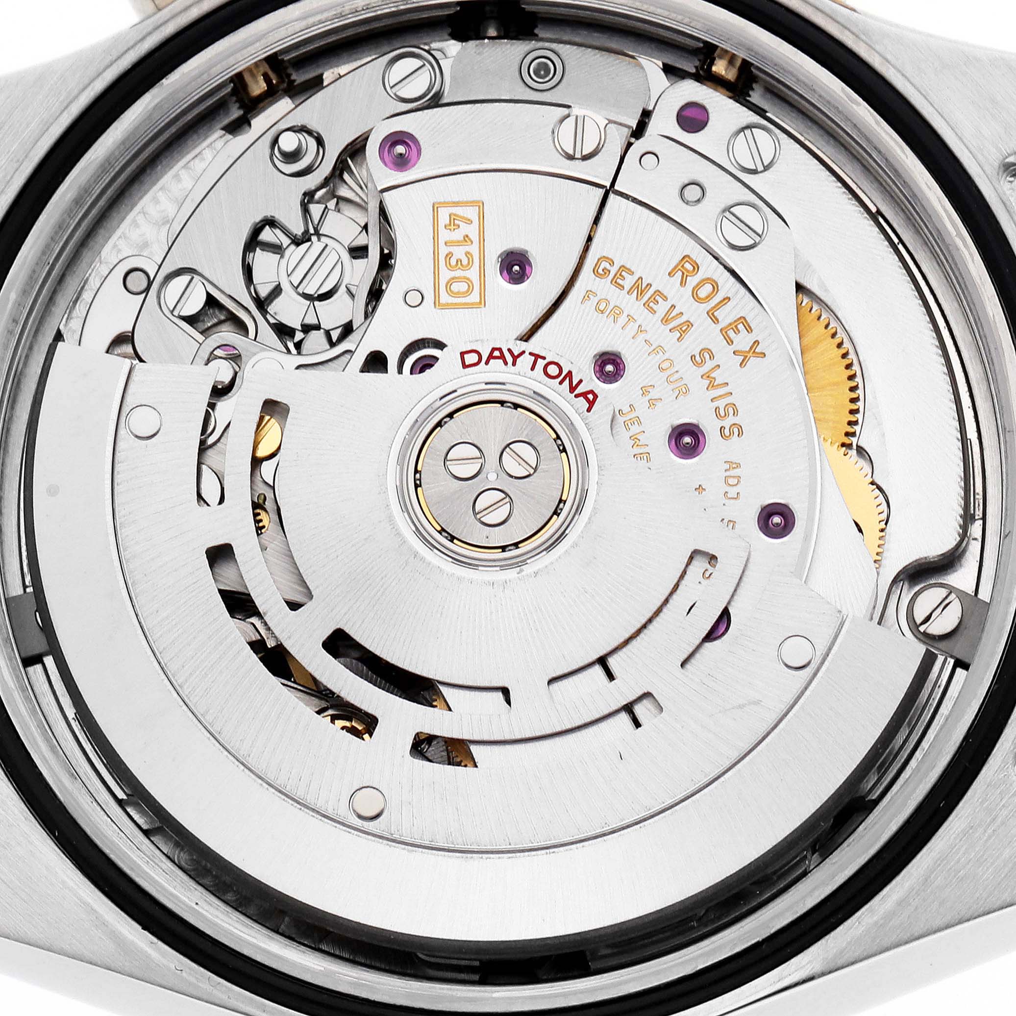 The image shows the movement of a Rolex Daytona 116523 Men's Steel and Gold (two tone) Blue Dial watch viewed from the back, highlighting gears and the rotor.