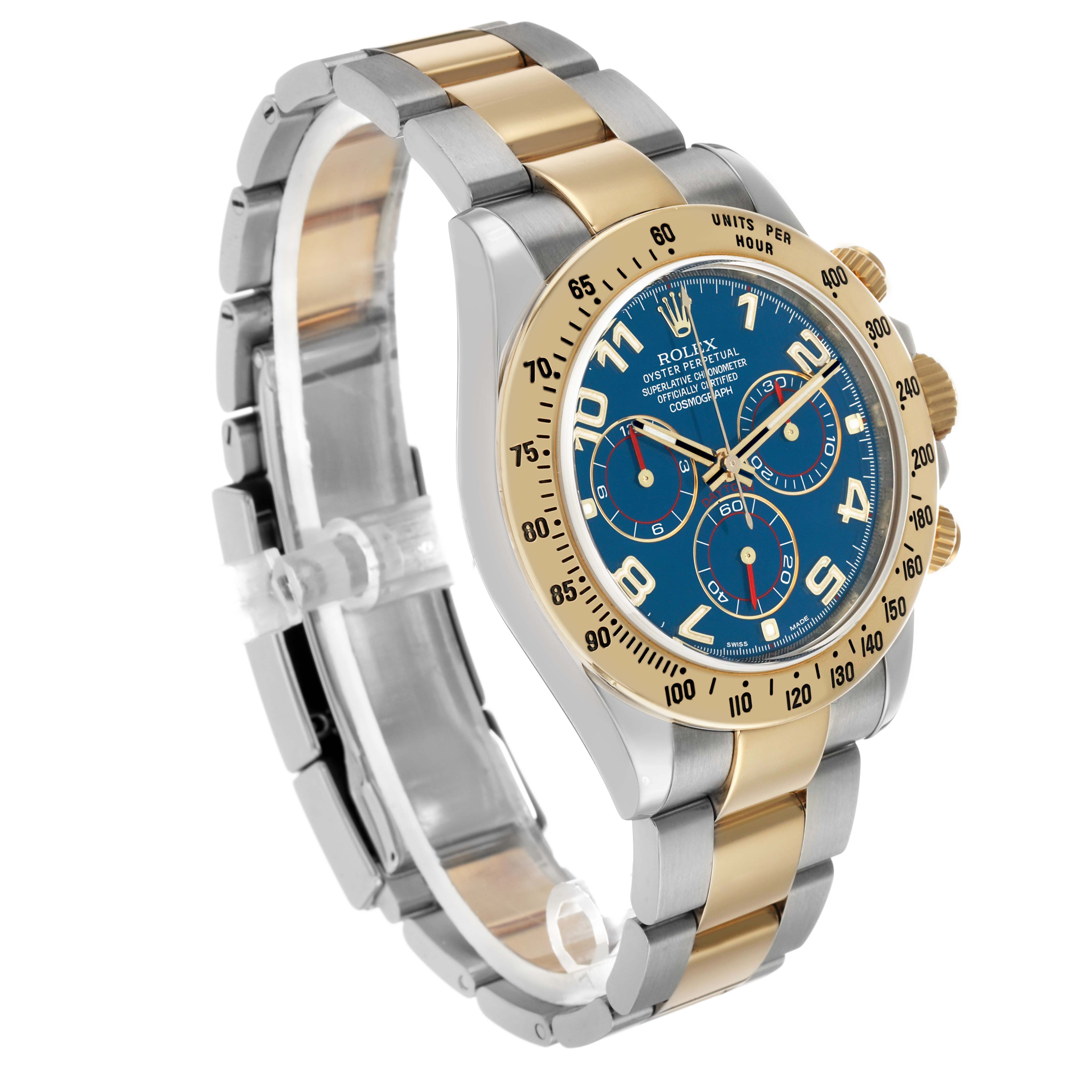 The Rolex Daytona 116523 Men's Steel and Gold (two tone) Blue Dial watch is shown at an angled close-up, displaying the face, bezel, chronograph dials, and two-tone bracelet.