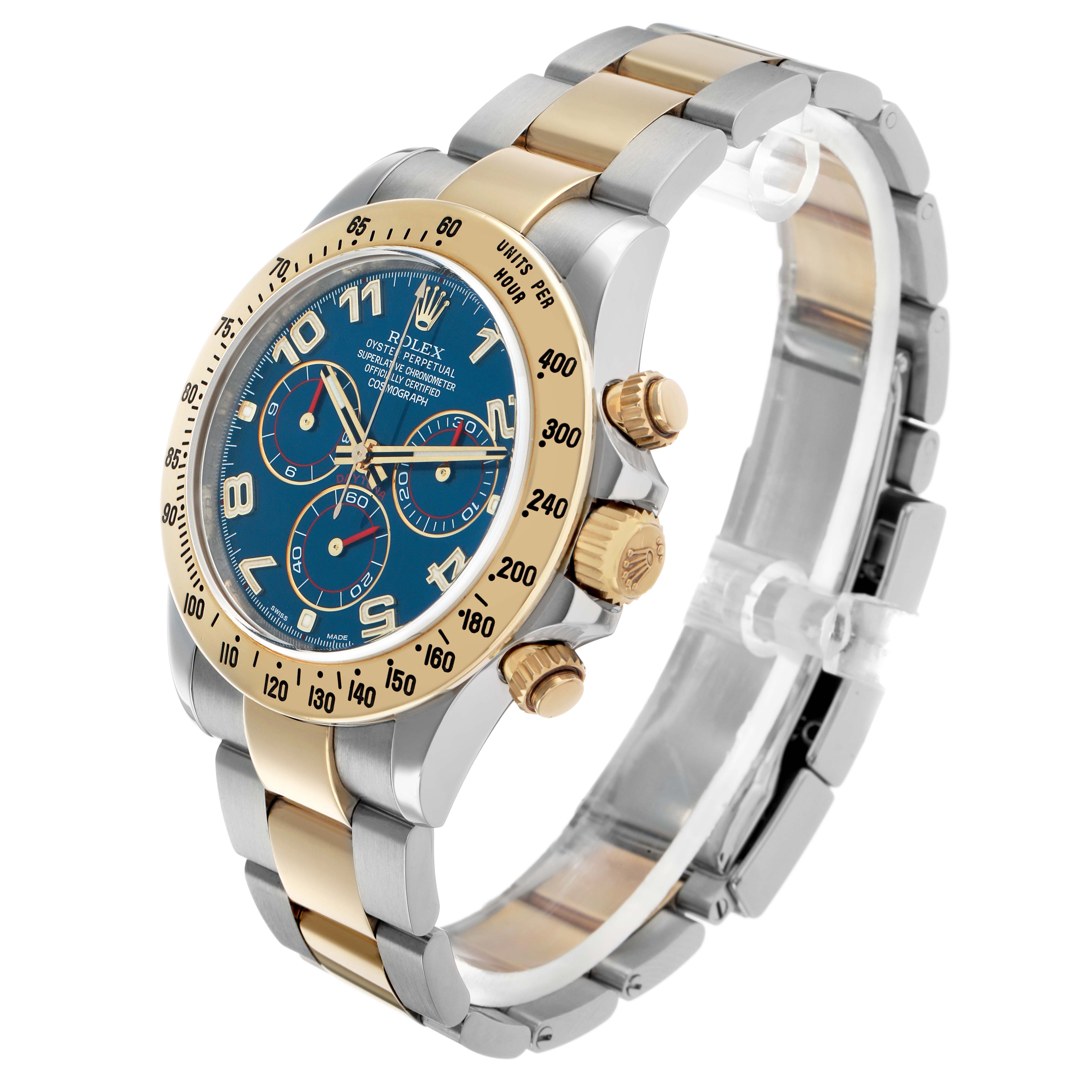 The Rolex Daytona 116523 Men's Steel and Gold (two tone) Blue Dial watch is shown from a three-quarter angle, highlighting the face, crown, and two-tone bracelet.