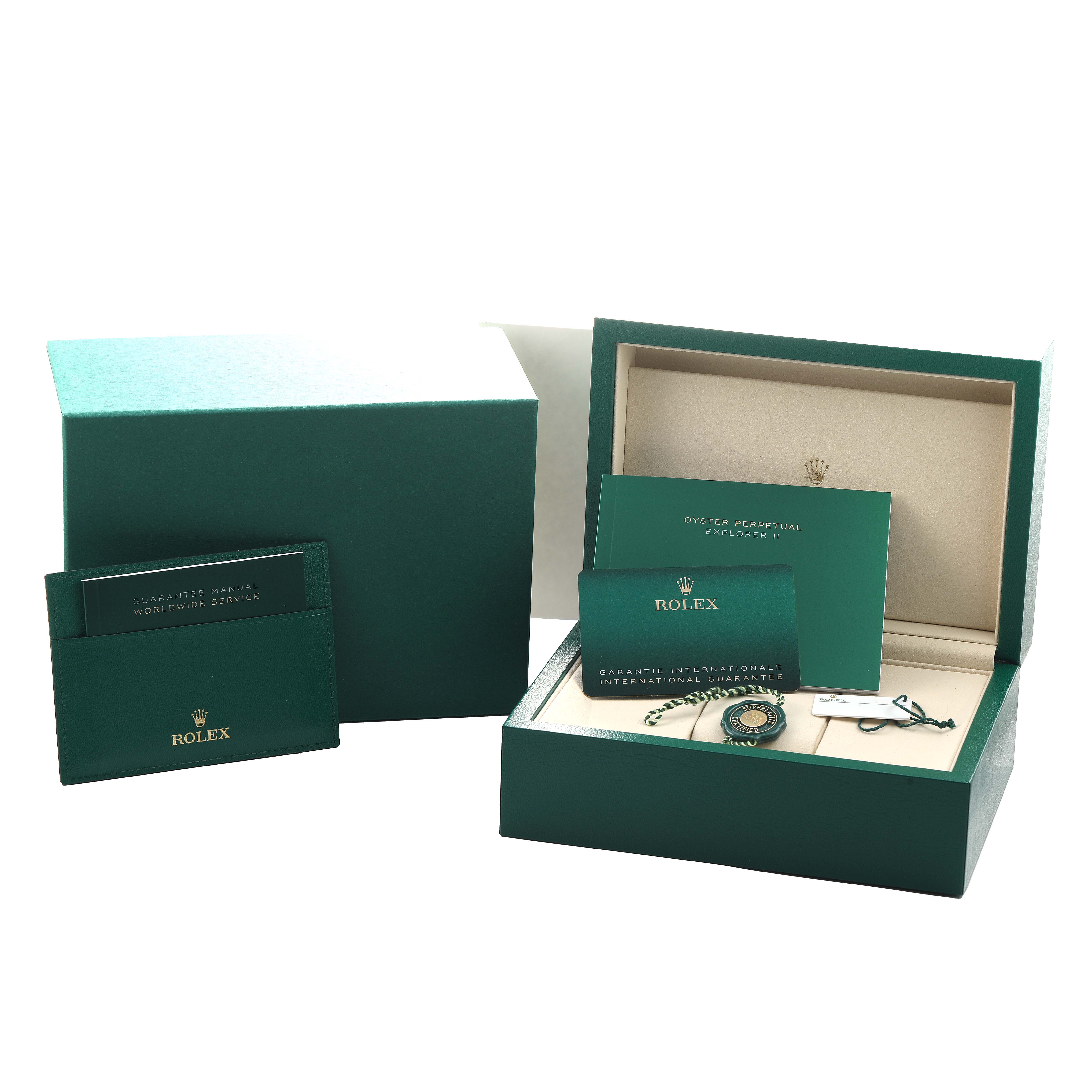 The image shows the Rolex Explorer 226570 Men's Stainless Steel White Dial packaging and accessories, including a box, warranty card, booklets, and tag.