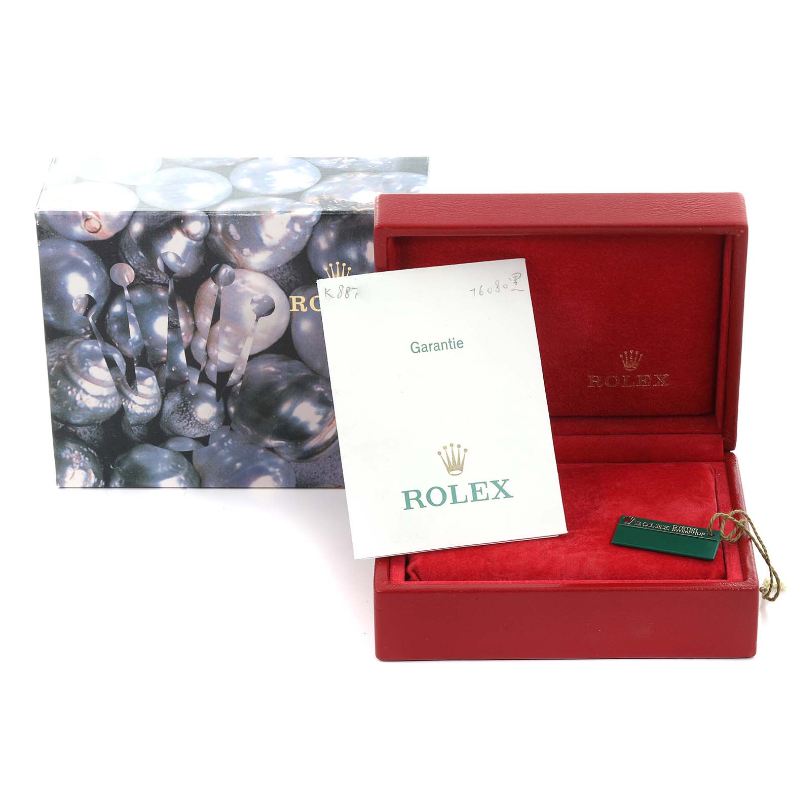 The image shows the packaging and documents for a Rolex Oyster Perpetual 76080 Women's Stainless Steel Black Dial 76080 Women's Stainless Steel Black Dial, including the box, warranty card, and tag.