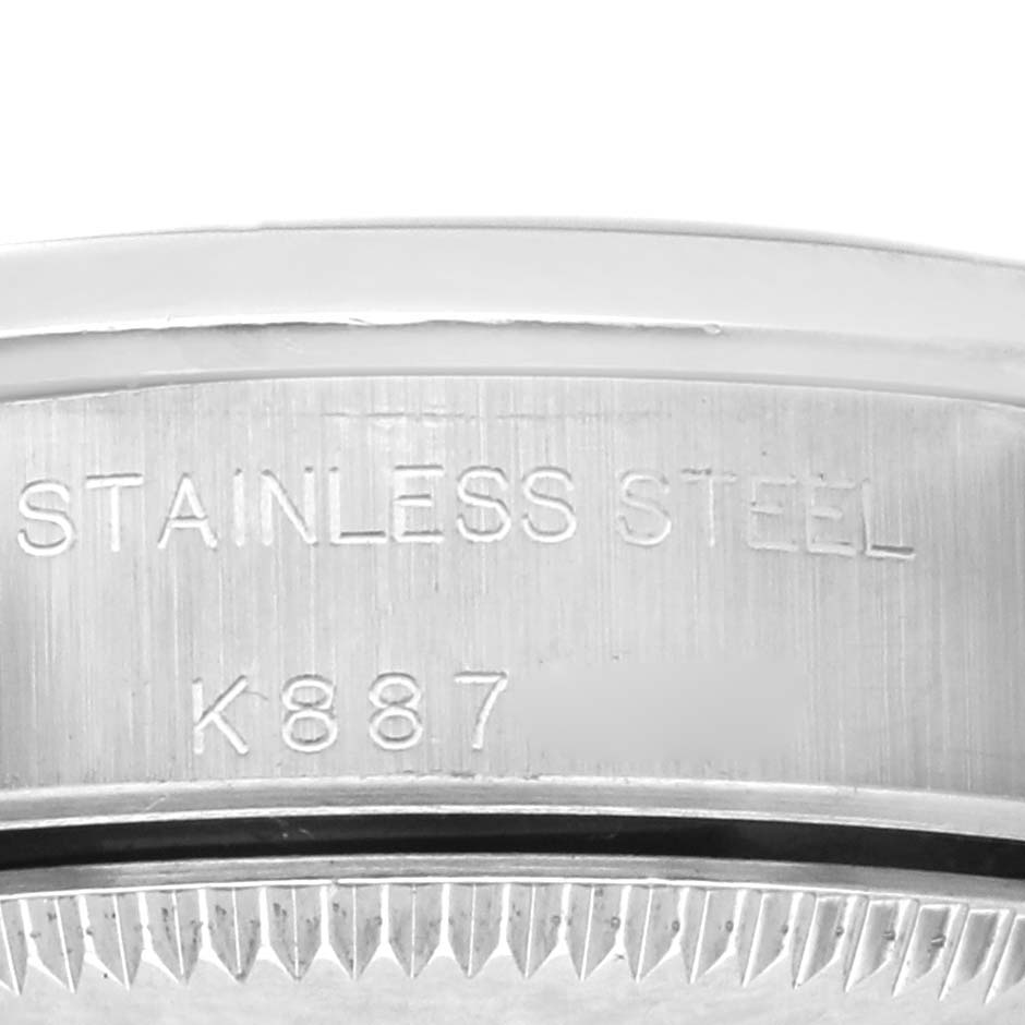 The image shows a close-up of the case back edge, featuring the engraved "Stainless Steel" marking on the Rolex Oyster Perpetual 76080 Women's Stainless Steel Black Dial 76080 Women's Stainless Steel Black Dial.