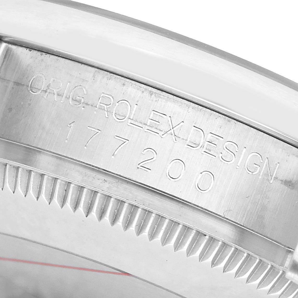 The image shows the side of a Rolex Mid-Size 177200 Women's Stainless Steel Blue Dial watch, highlighting the engraved model number and fluted bezel.