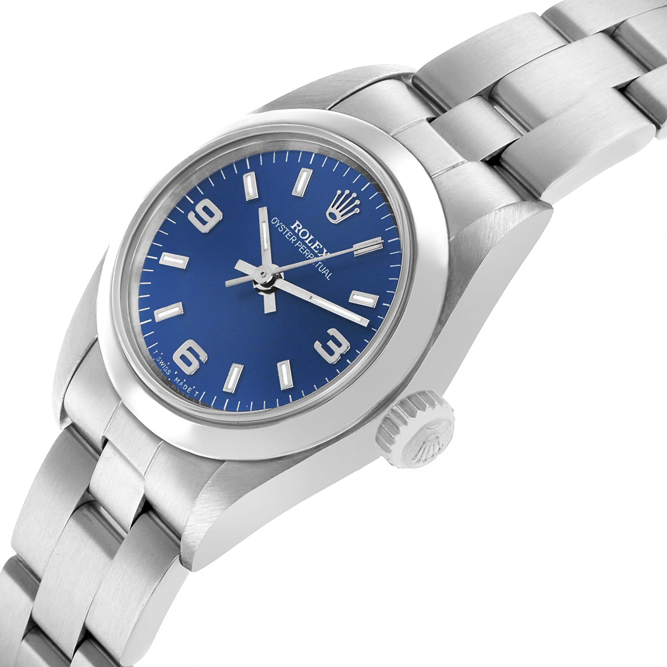 The Rolex Oyster Perpetual 67180 Women's Stainless Steel Blue Dial watch is shown from a side angle, highlighting the dial, crown, and bracelet.