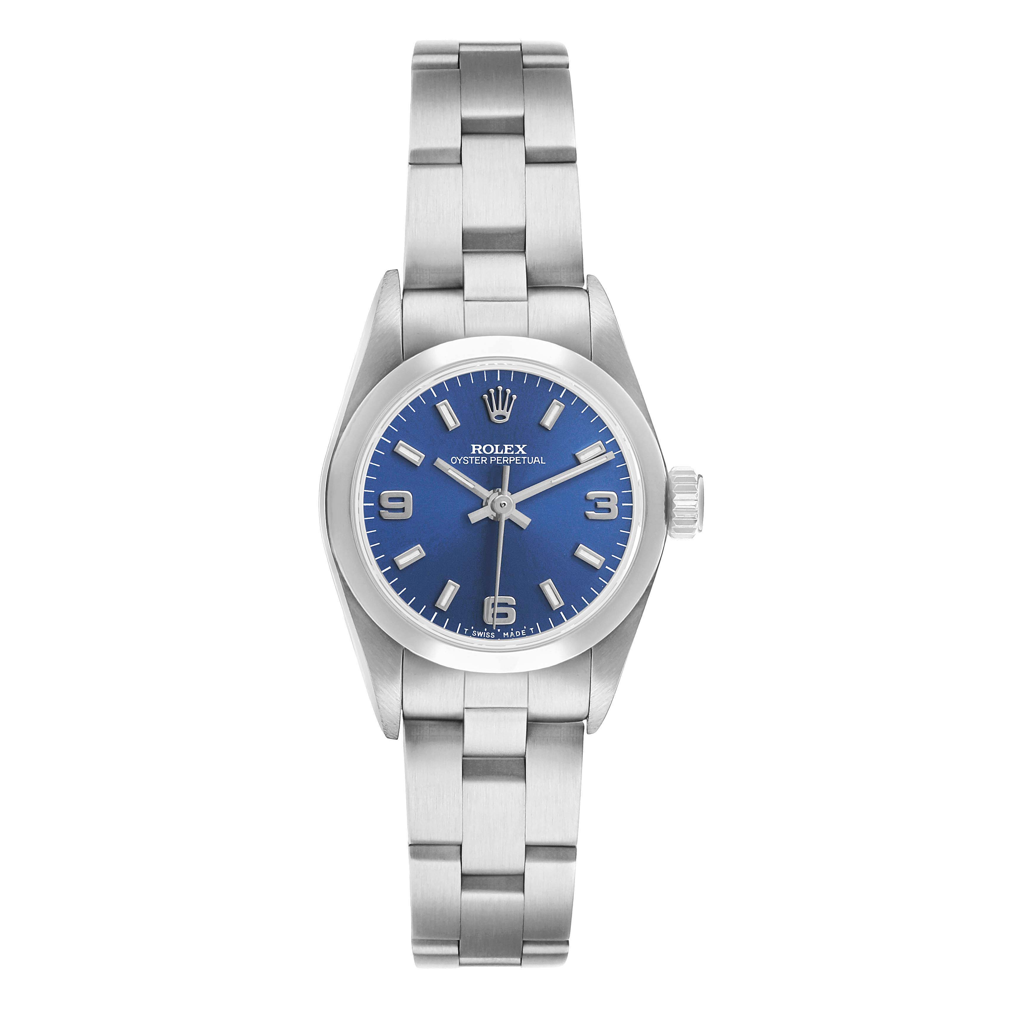 The Rolex Oyster Perpetual 67180 Women's Stainless Steel Blue Dial watch is shown from a straight-on angle, displaying the blue dial, bracelet, and crown.