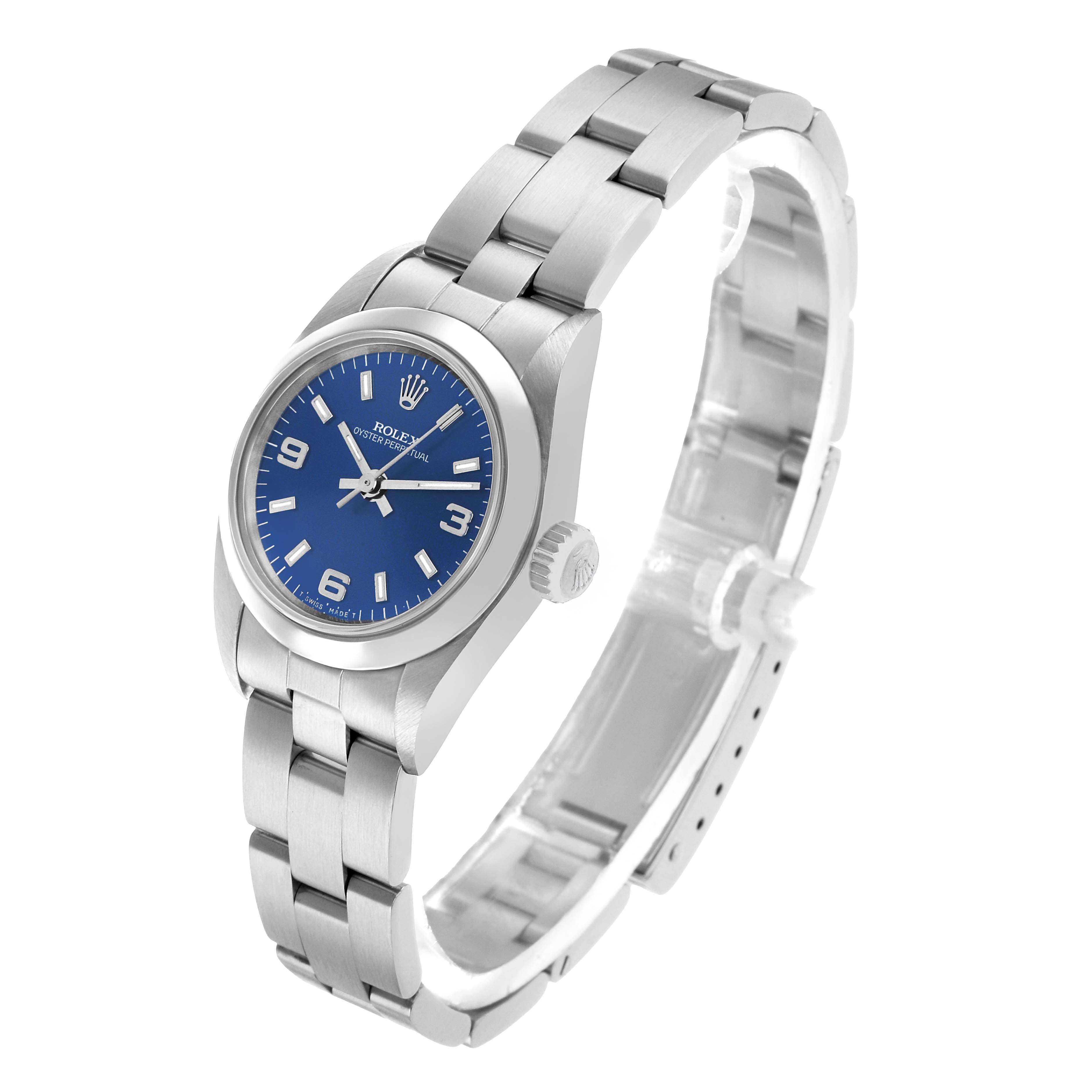 The Rolex Oyster Perpetual 67180 Women's Stainless Steel Blue Dial watch is shown at a three-quarter angle, displaying the face, bracelet, and crown.