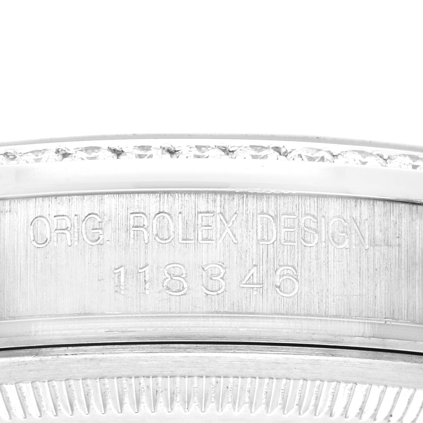 The image shows a close-up of the side of a Rolex President 118346 Men's Platinum Mother of Pearl Dial 118346 Men's Platinum Mother of Pearl Dial model, highlighting the engraved serial number.