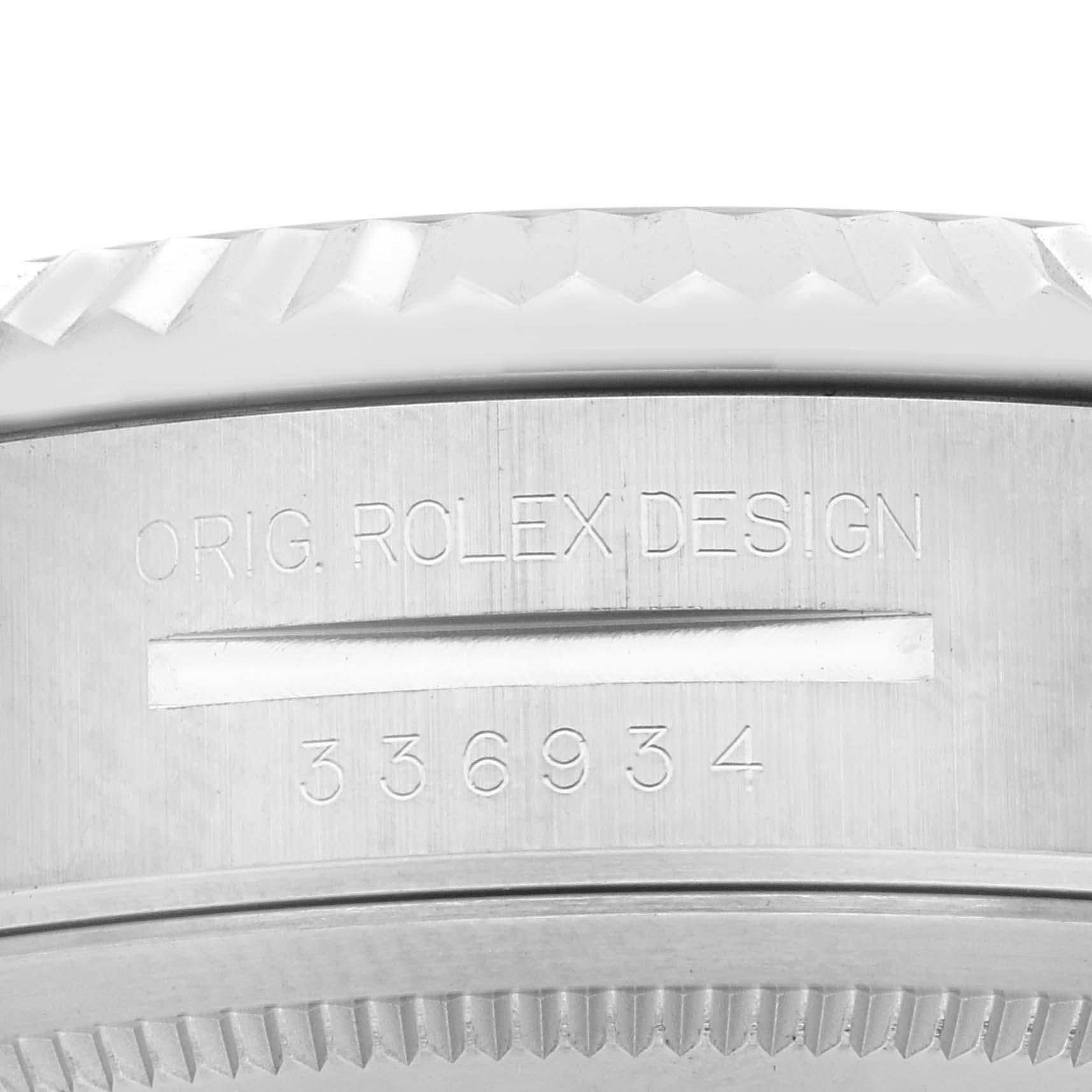 The image shows a close-up of the Rolex Sky-Dweller 336934 Men's Stainless Steel Green Dial 336934 Men's Stainless Steel Green Dial's side, highlighting its design details and serial number.