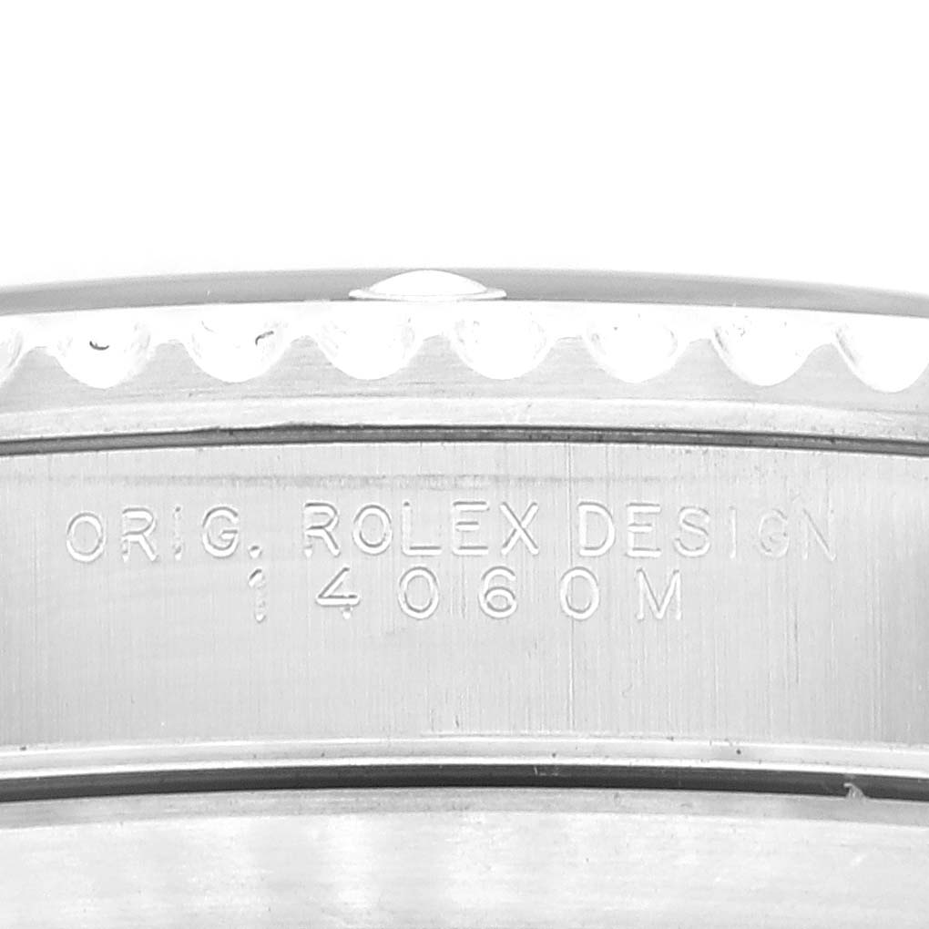 This image shows a close-up of the side of a Rolex Submariner 14060M Men's Stainless Steel Black Dial 14060M Men's Stainless Steel Black Dial watch, highlighting the engraved "Original Rolex Design 4060M" on the casing.