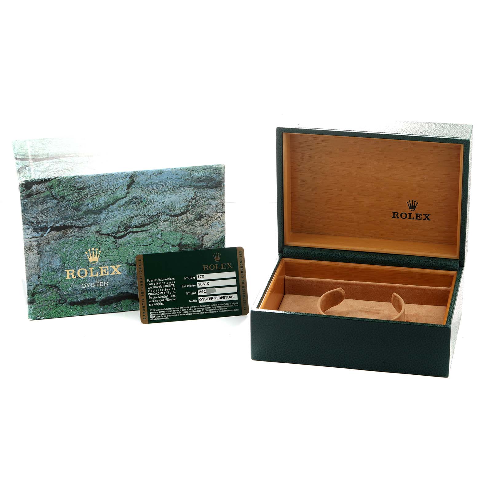 The image shows the box, certificate, and booklet for a Rolex Submariner 16610 Men's Stainless Steel Black Dial, with an angled view of the open box interior.