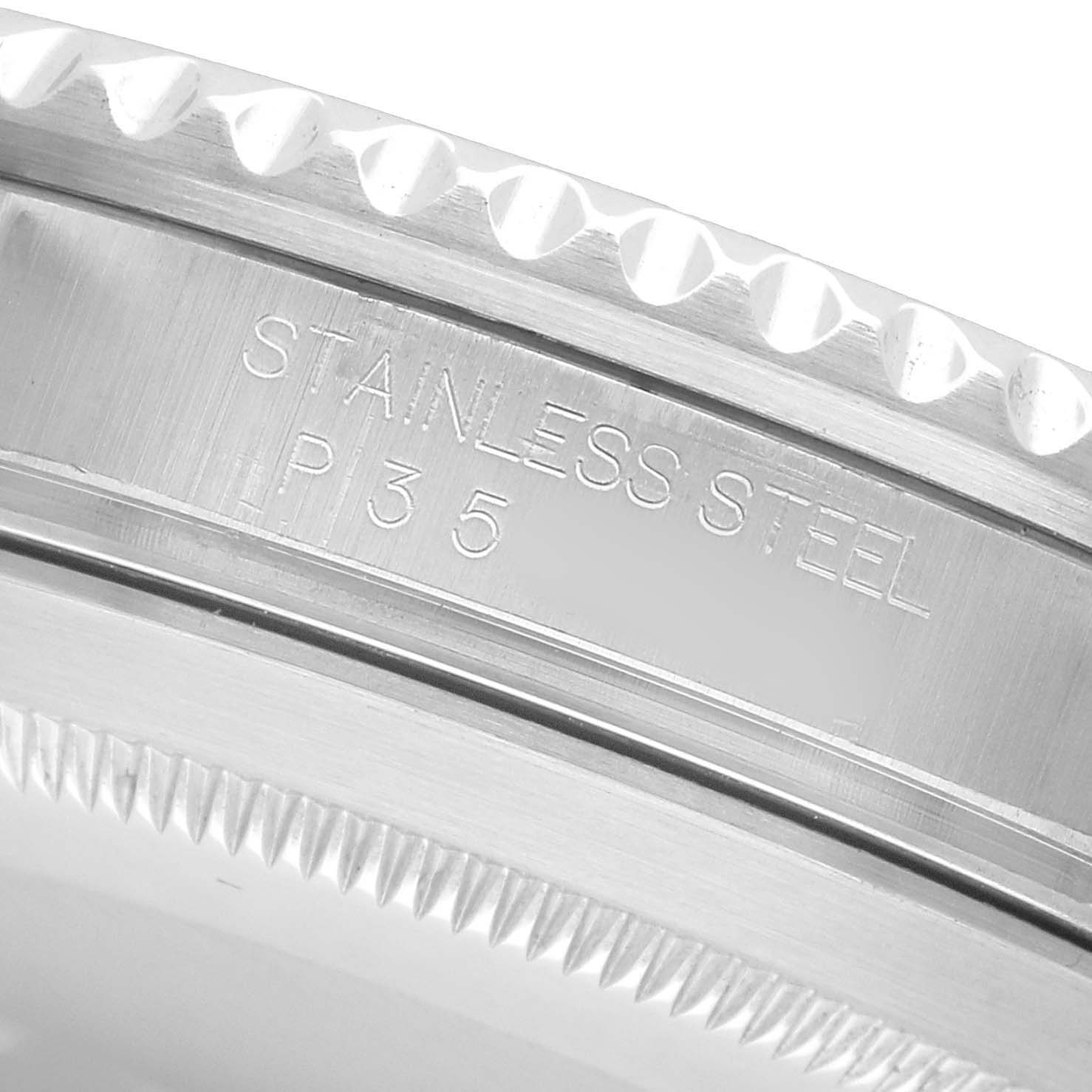 The image shows a close-up of the side of the Rolex Submariner 16610 Men's Stainless Steel Black Dial's stainless steel bezel and case edge.