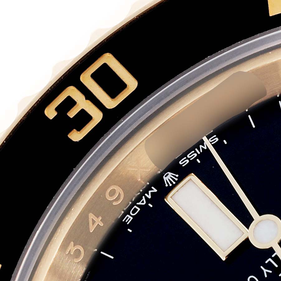 The image shows a close-up of the dial and bezel, highlighting details of the Rolex Submariner 126618 Men's Yellow Gold Black Dial 126618 Men's Yellow Gold Black Dial watch.