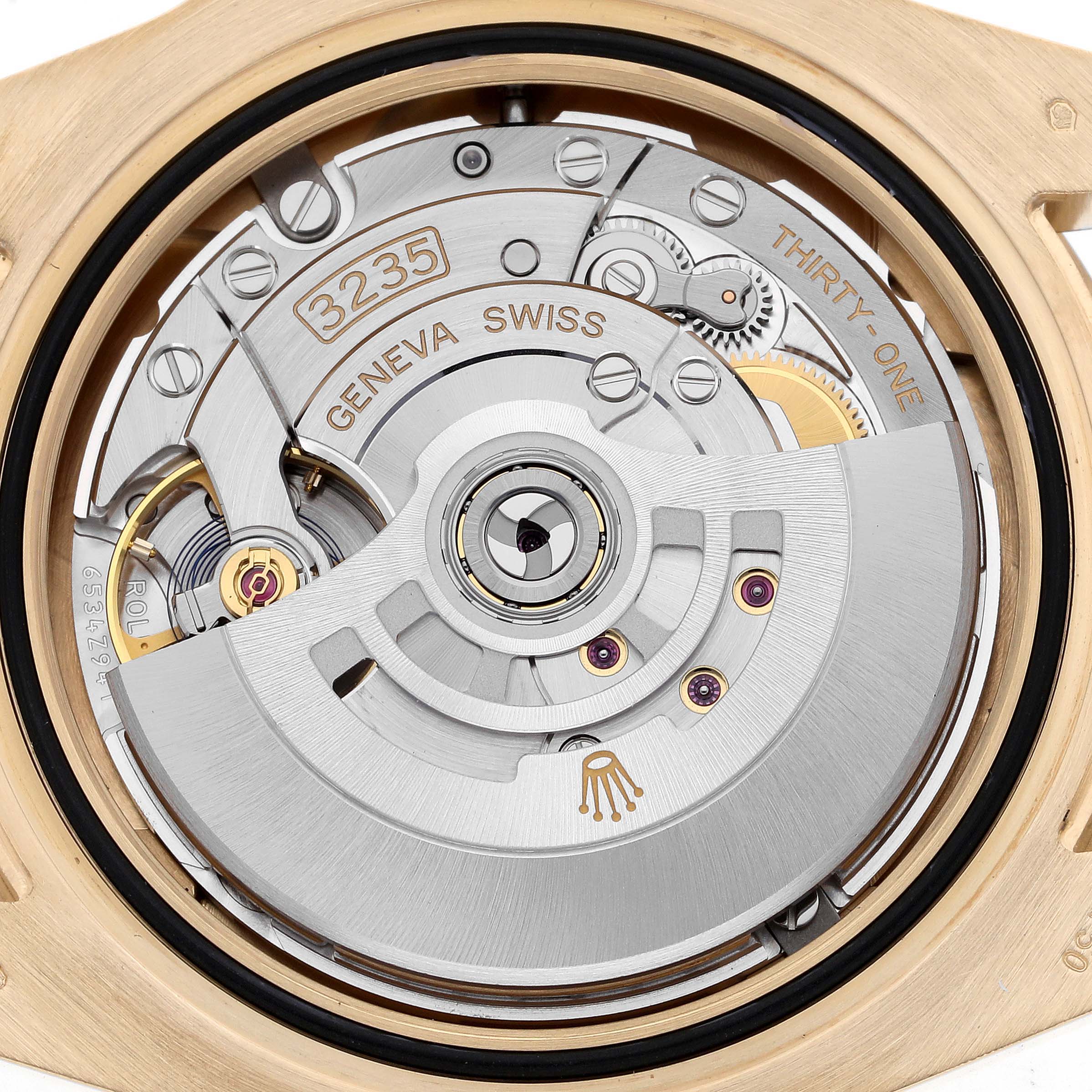 This image shows the movement of a Rolex Submariner 126618 Men's Yellow Gold Black Dial 126618 Men's Yellow Gold Black Dial, focusing on the rotor and intricate components from the back.