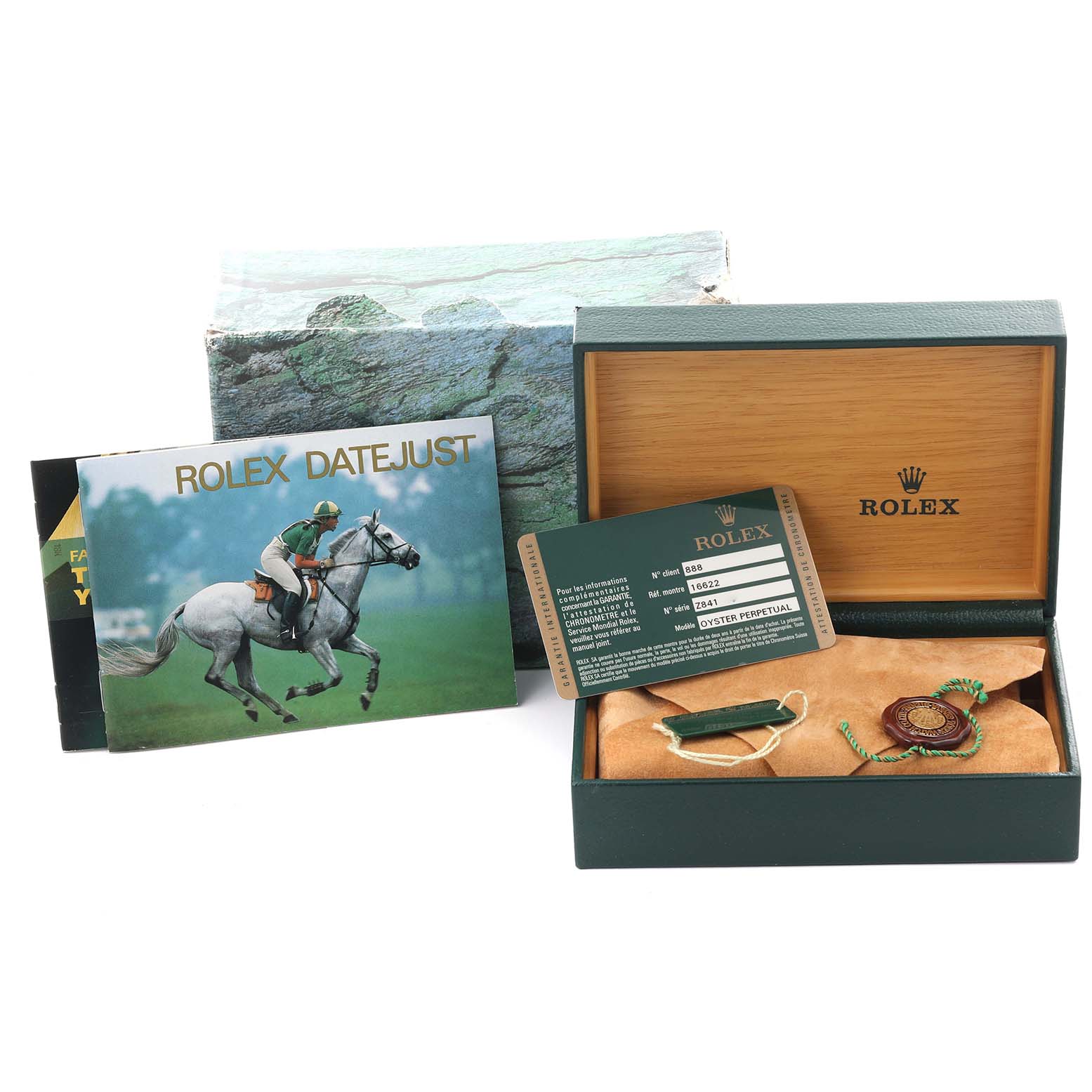 The image shows the packaging, booklets, and accessories for a Rolex Yacht-Master 16622 Men's Steel and Gold (two tone) Silver Dial 16622 Men's Steel and Gold (two tone) Silver Dial watch.