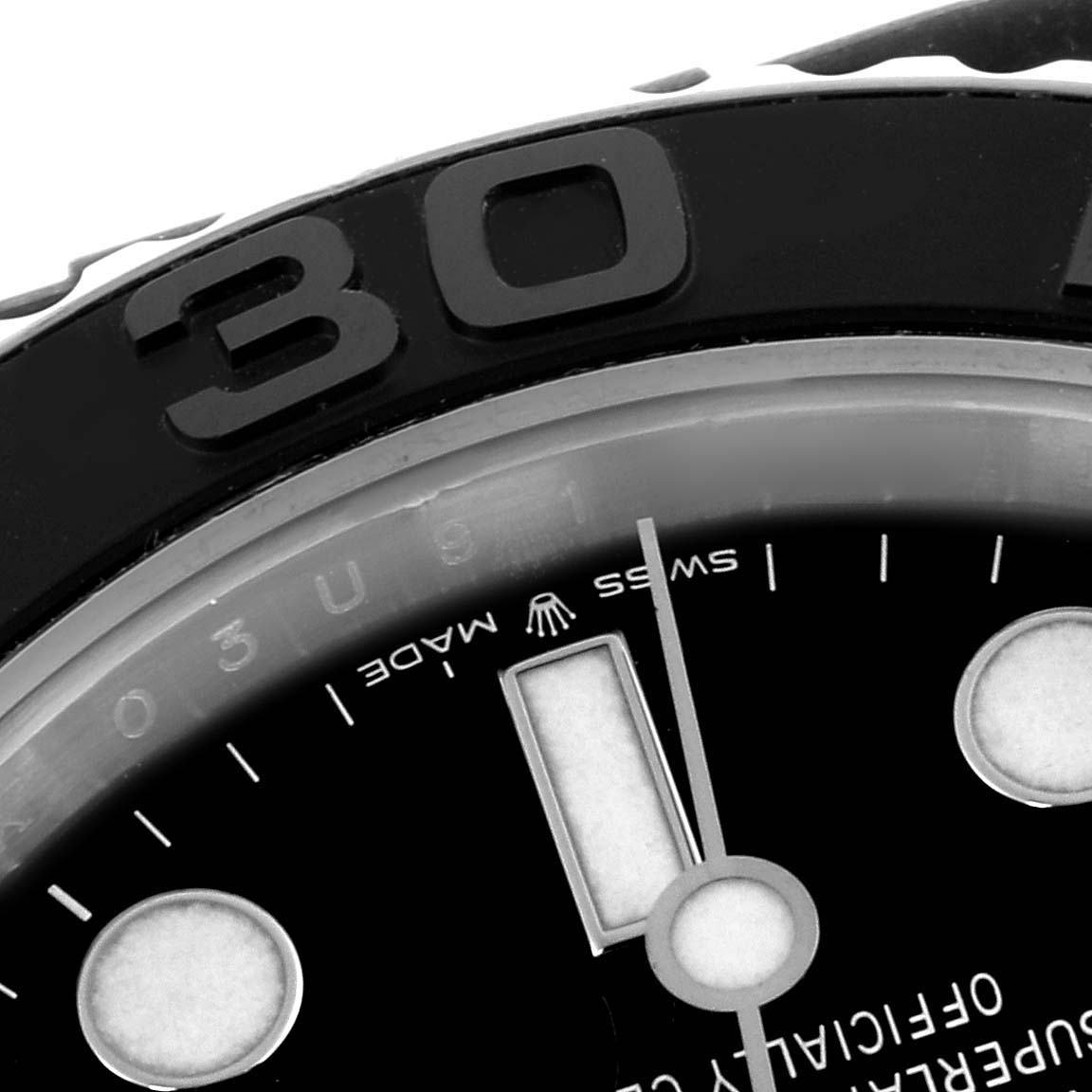 The image shows a close-up of the Rolex Yacht-Master 226659 Men's White Gold Black Dial 226659 Men's White Gold Black Dial dial and bezel, focusing on the “30” marker and part of the hour hand.