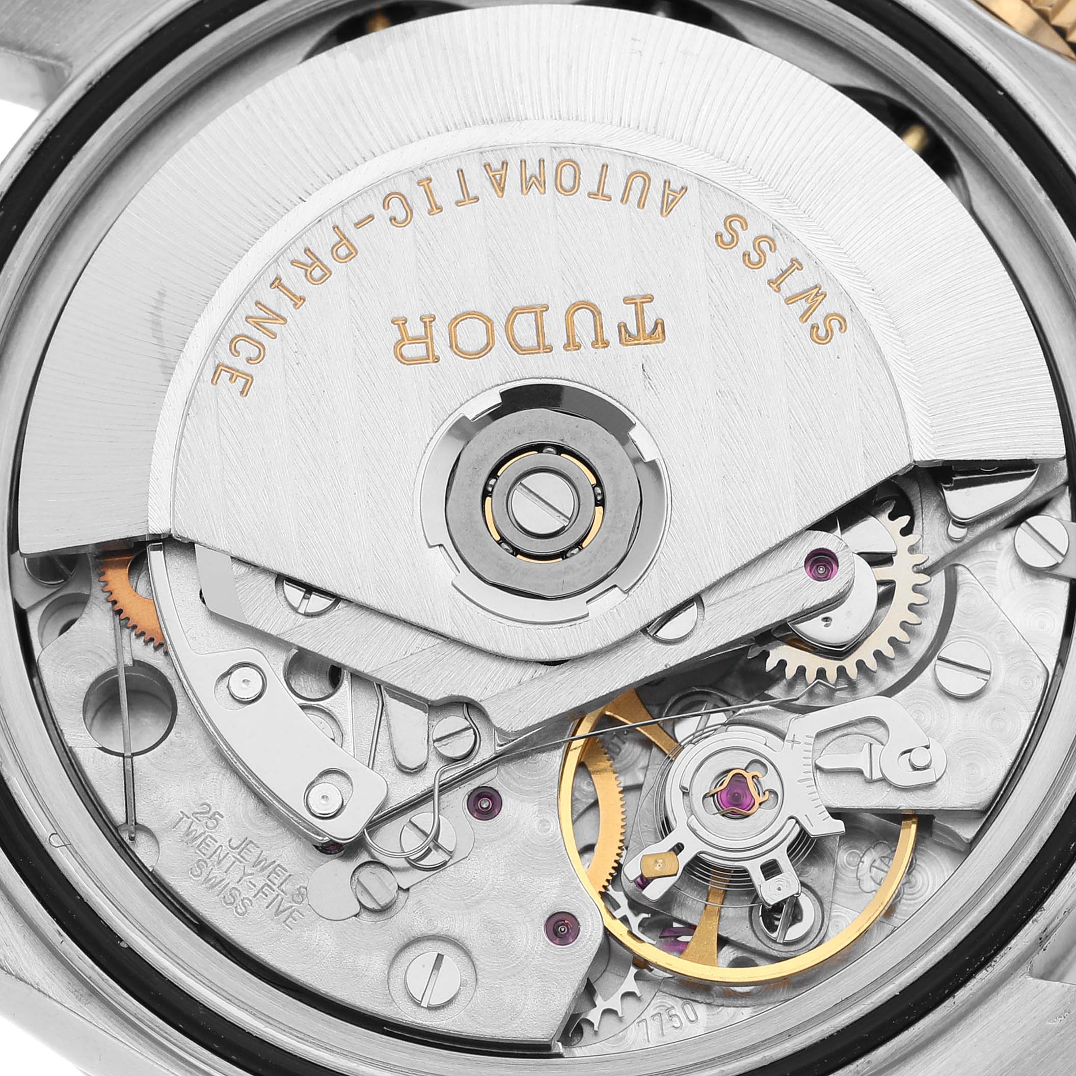 The image displays the movement and intricate internal components of the Tudor Tiger 79263 Men's Steel and Gold (two tone) White Dial 79263 Men's Steel and Gold (two tone) White Dial watch, captured from the back.