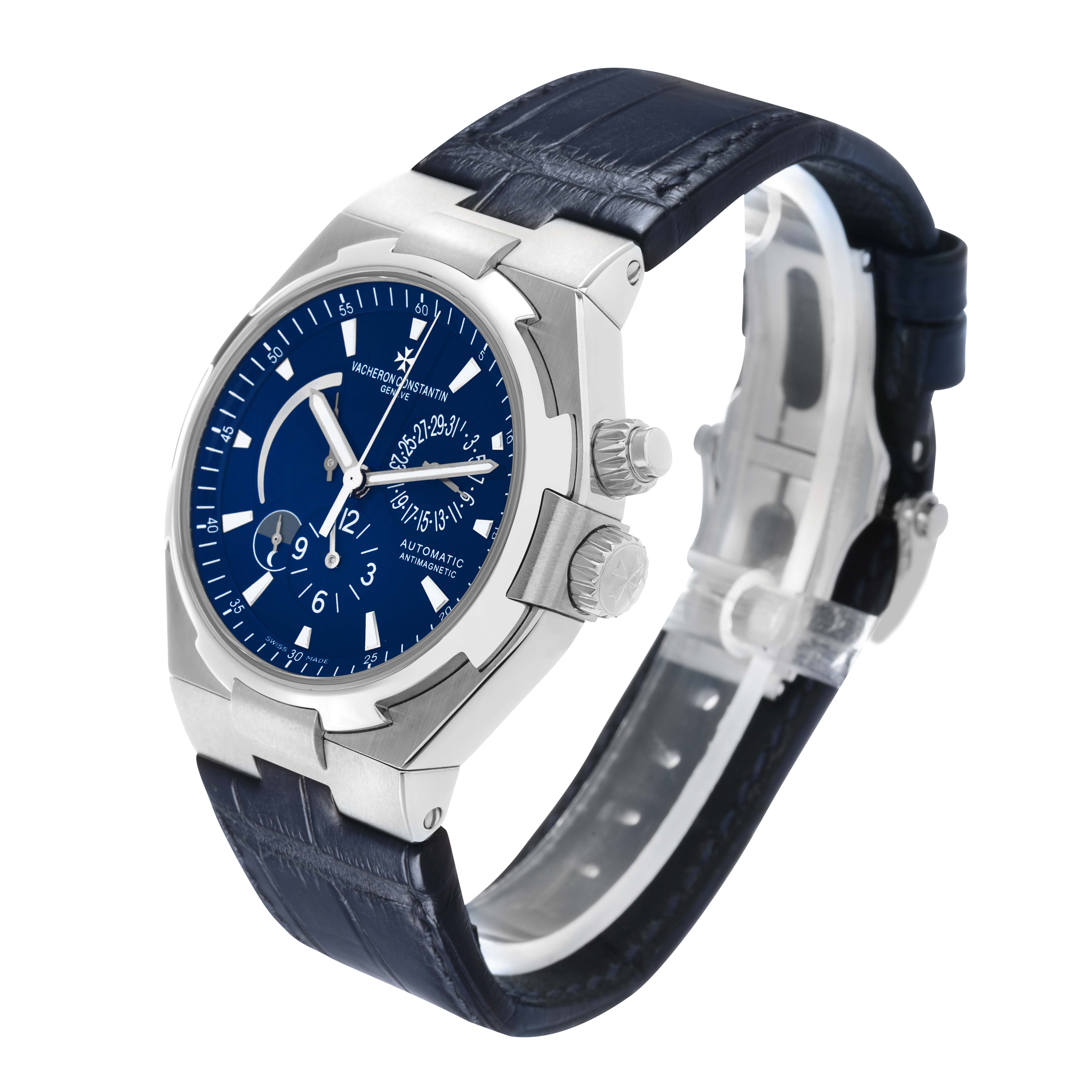 The Vacheron Constantin Overseas 47450 Men's Stainless Steel Blue Dial watch is shown at a three-quarter angle, highlighting the dial, crown, and blue leather strap.