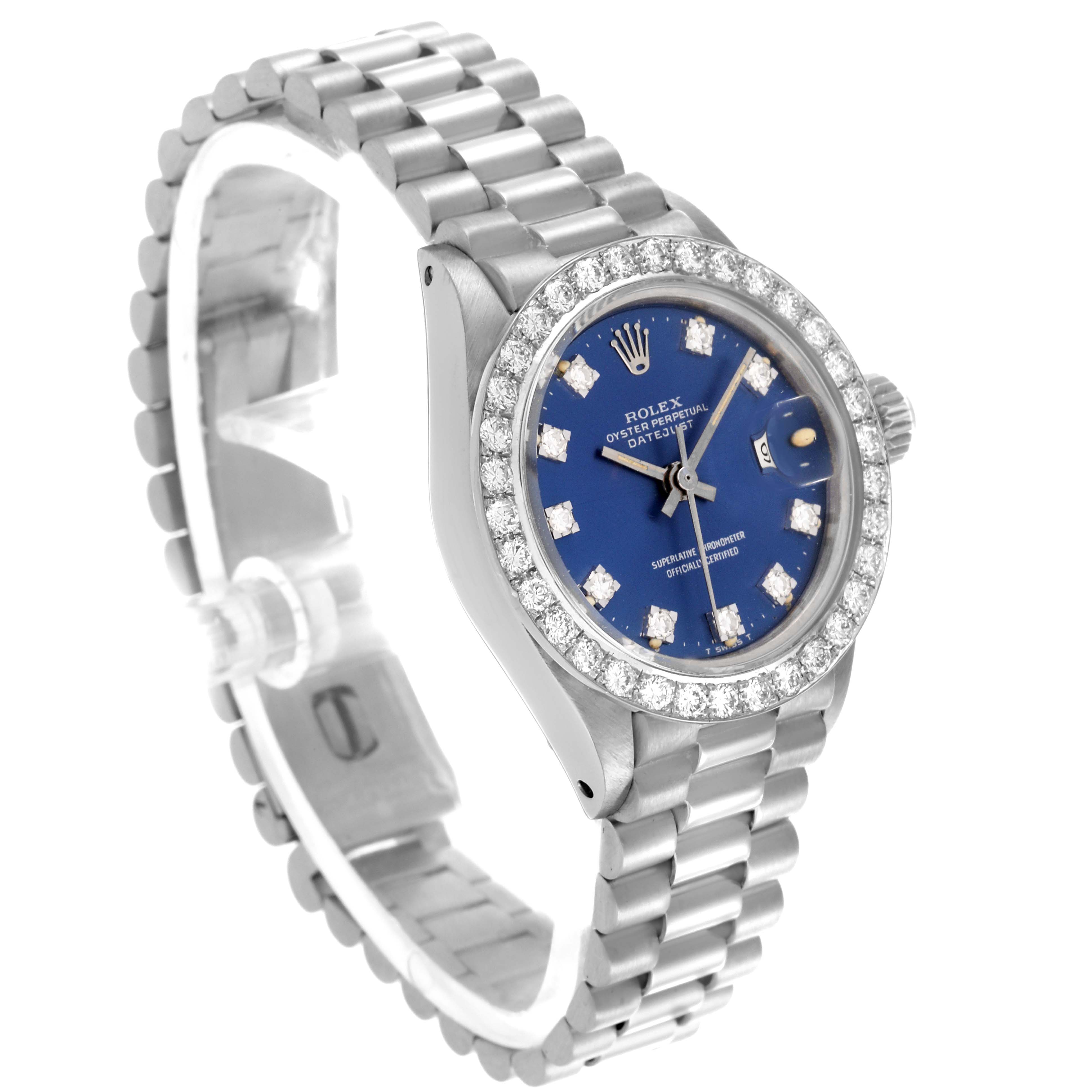 The Rolex President 6913 Women's White Gold Blue Dial 6913 Women's White Gold Blue Dial watch is shown at a three-quarter angle, highlighting the blue dial, diamond bezel, and metal bracelet.