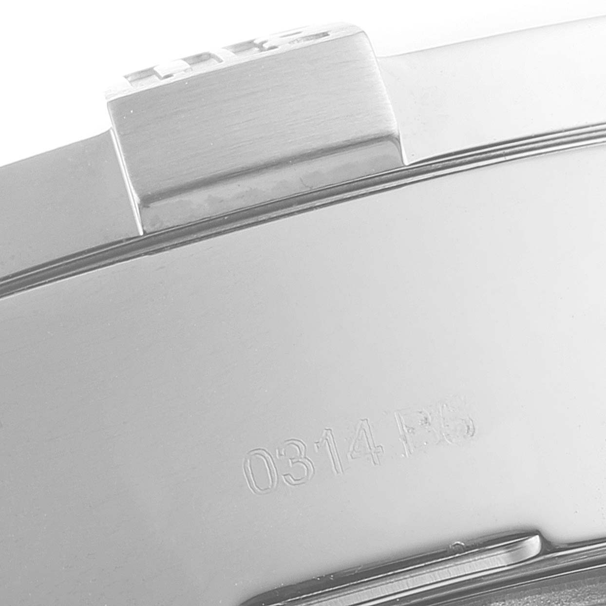 The image shows a close-up of the side of the Breitling Avenger A13371 Men's Stainless Steel Black Dial A13371 Men's Stainless Steel Black Dial watch, focusing on the clasp and part of the engraved serial number.