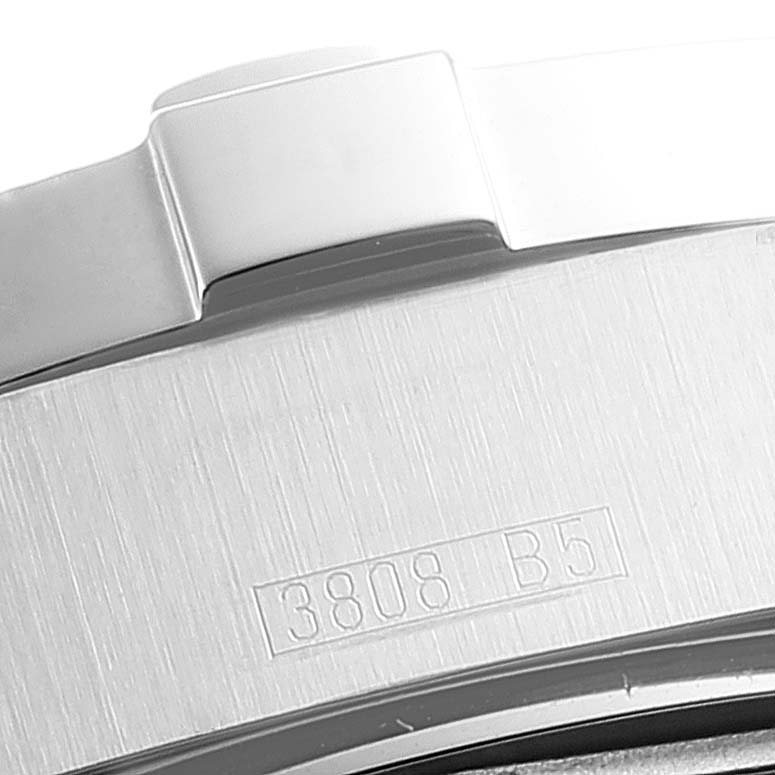 This close-up image of the Breitling Superocean A17390 Men's Stainless Steel Silver Dial A17390 Men's Stainless Steel Silver Dial watch shows the side of the bezel with an engraved reference number.