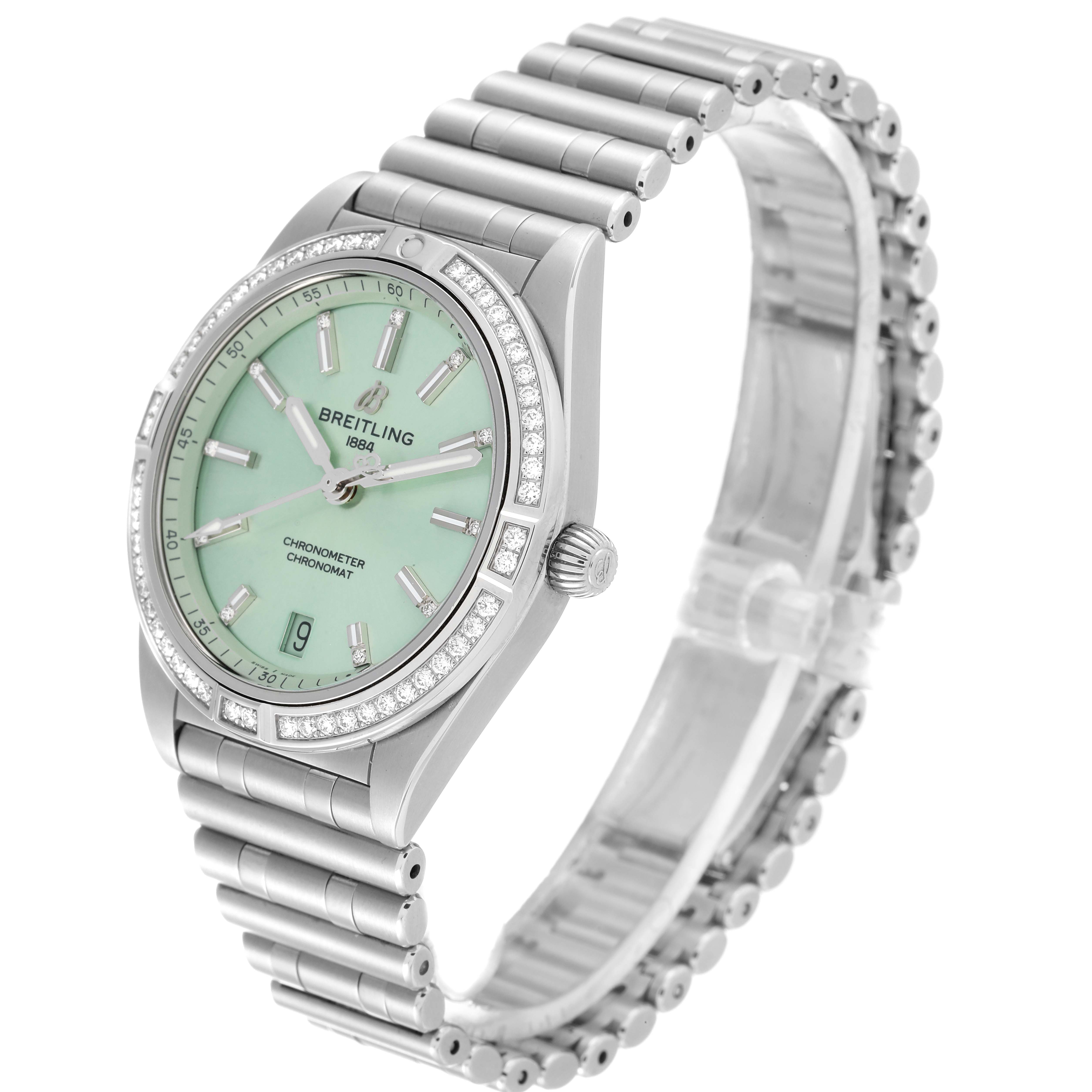 The Breitling A10380591L1A1 Women's Stainless Steel Green Dial A10380591L1A1 Women's Stainless Steel Green Dial Chronomat A10380 watch is shown at an angle highlighting its green dial, steel case, and diamond bezel.