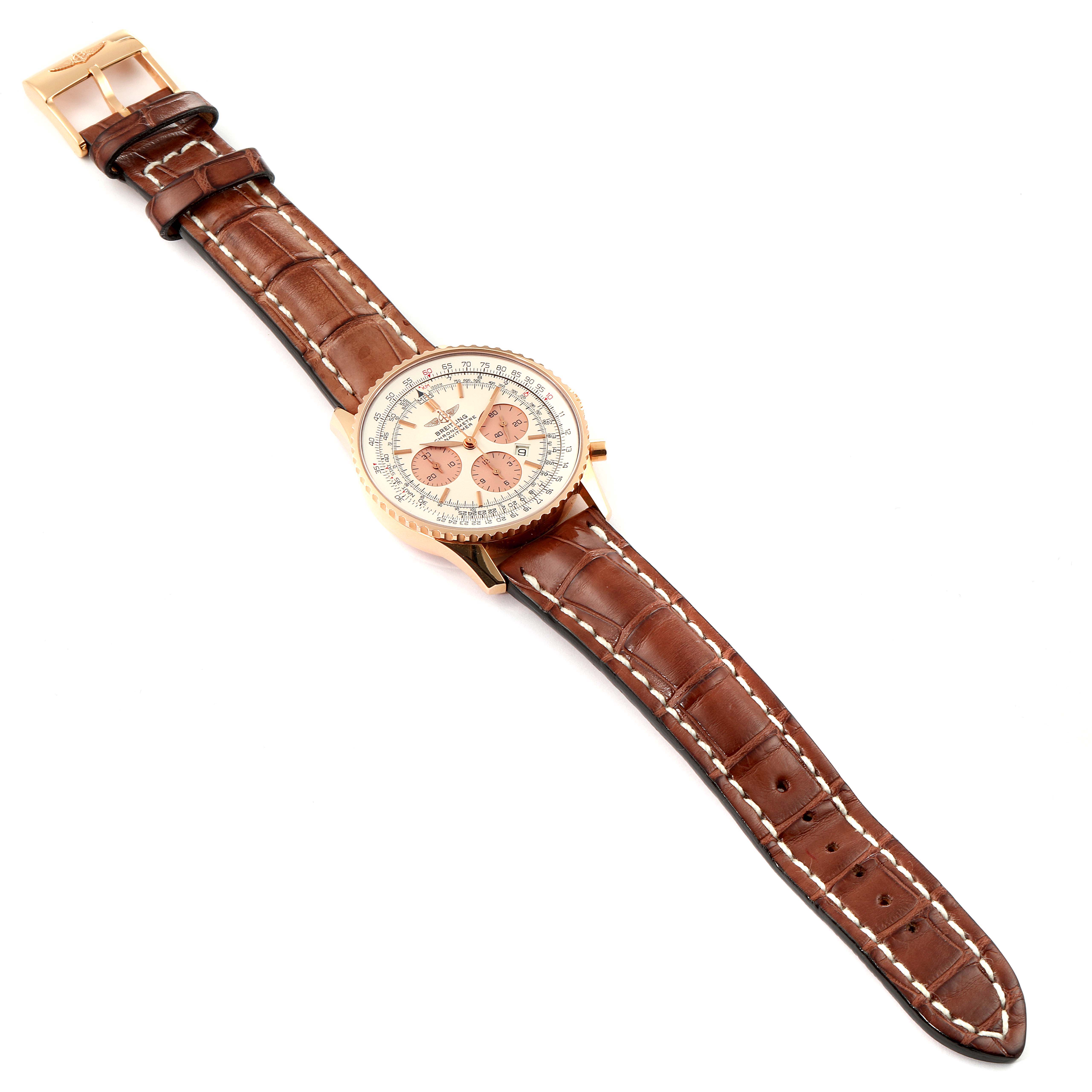 The Breitling Navitimer R41380 Men
s Rose Gold Silver Dial R41380 Men
s Rose Gold Silver Dial watch is shown from a top-down angle, displaying its brown leather strap and detailed face with multiple dials and markers.