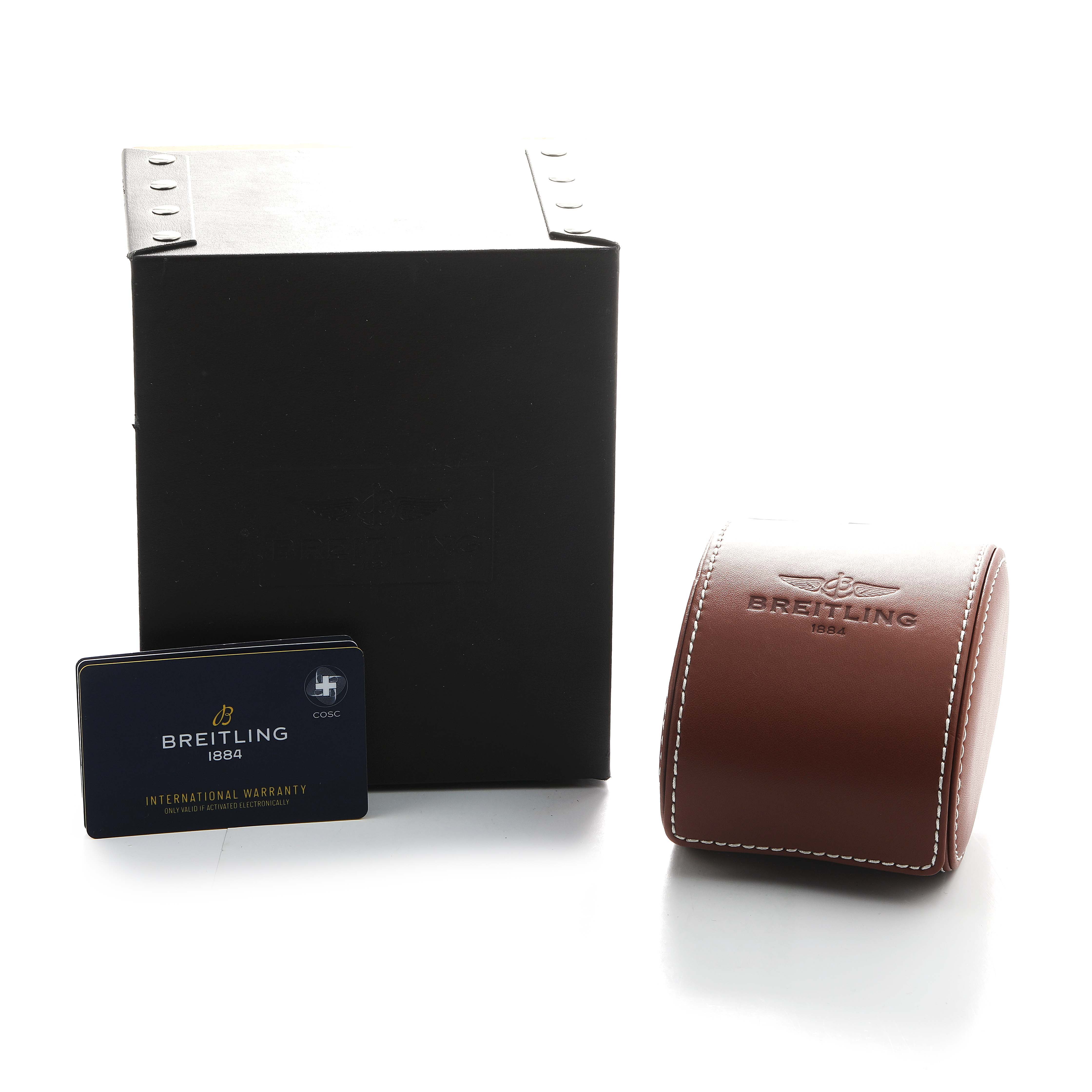 The image shows Breitling Superocean U13313 Men's Stainless Steel Black Dial packaging, a brown leather case, and an international warranty card upright against a black box.