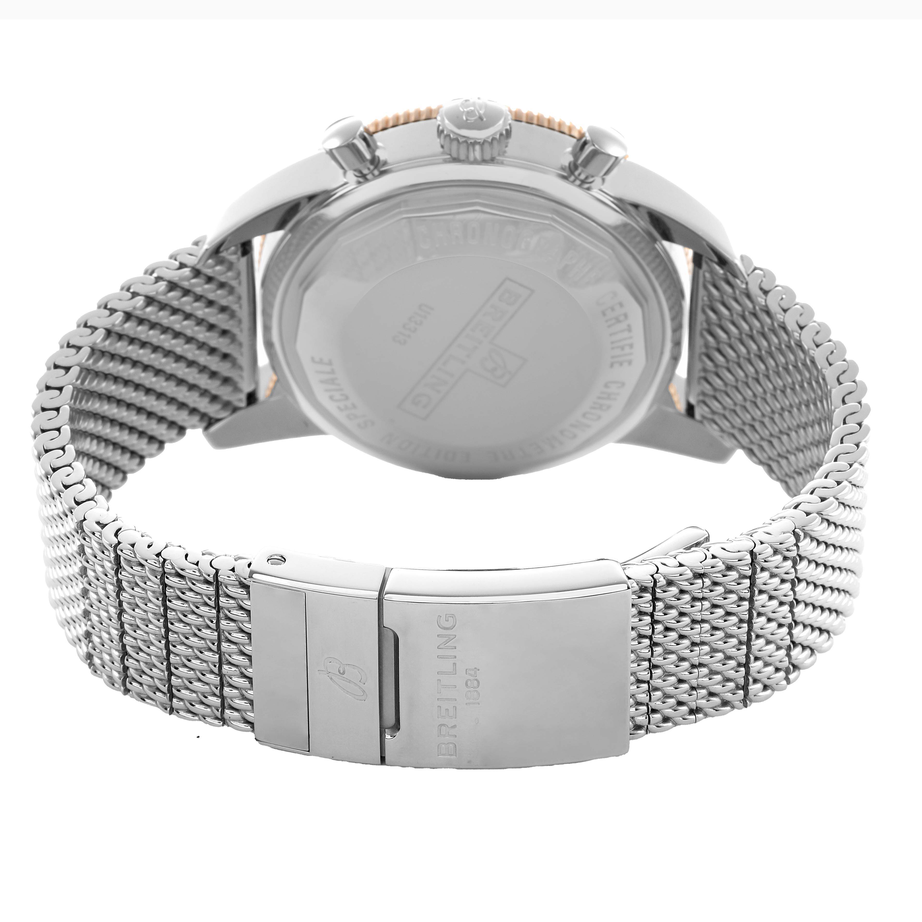 The image shows a Breitling Superocean U13313 Men's Stainless Steel Black Dial watch from the back, featuring the clasp, case back, and mesh bracelet.