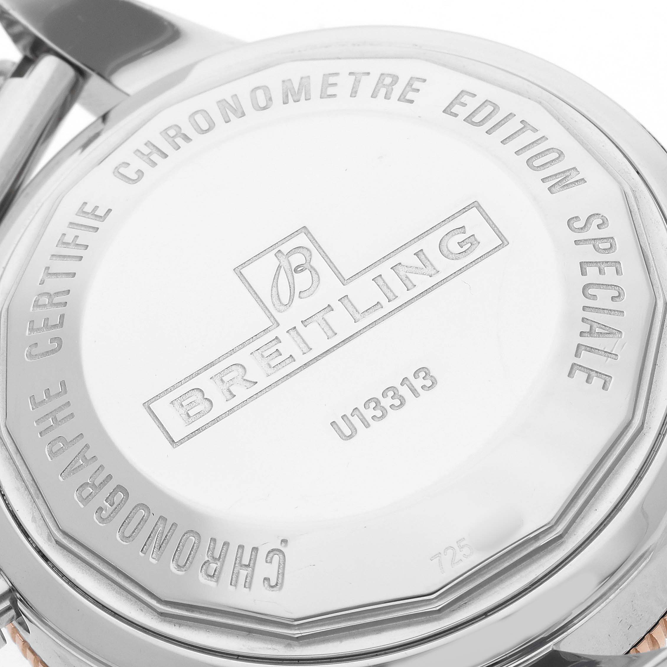 The image shows the back case of a Breitling Superocean U13313 Men's Stainless Steel Black Dial watch with engraved details and the model number.