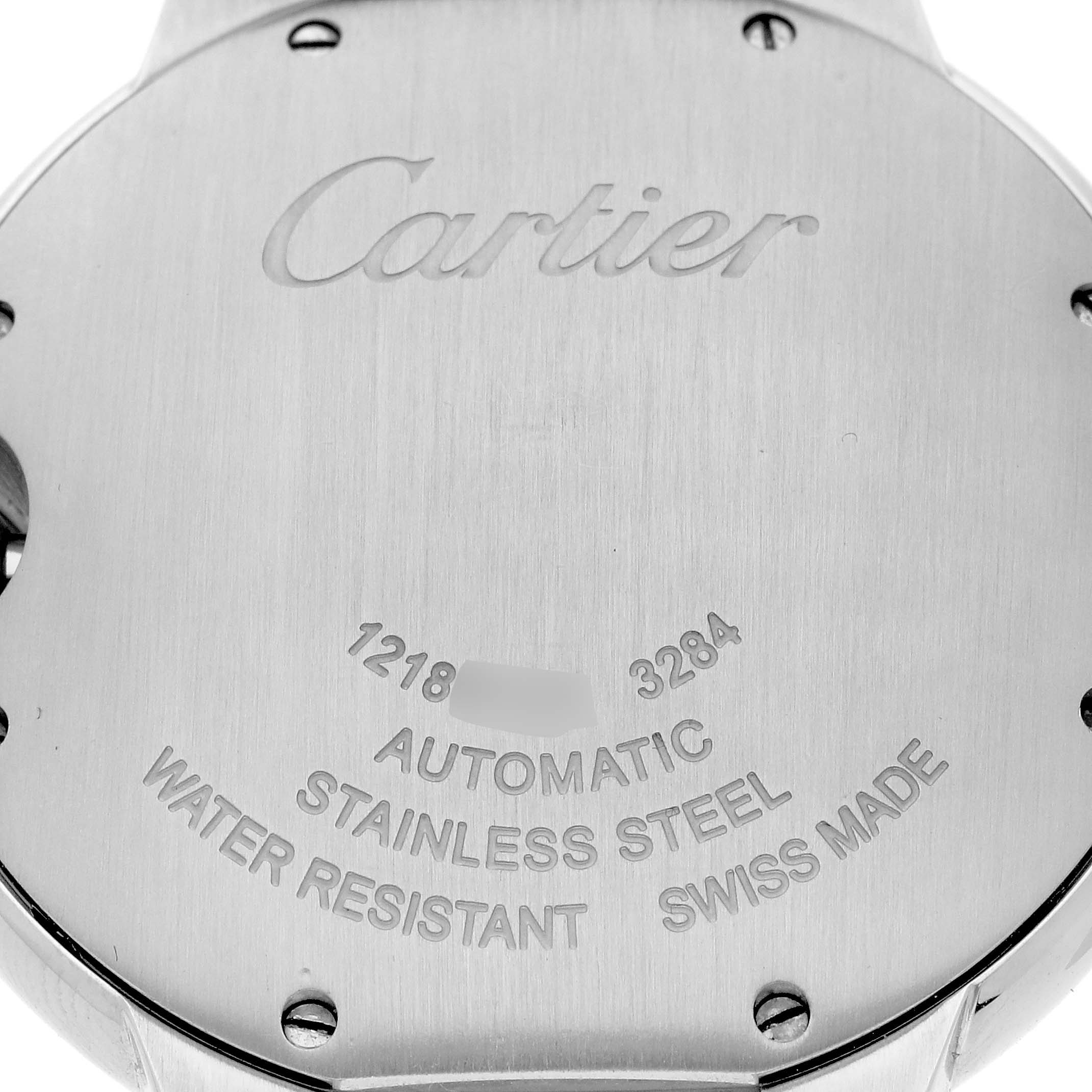 The image shows the back case of a Ballon Bleu de Cartier watch, featuring engraving details like "Automatic" and "Swiss Made."
