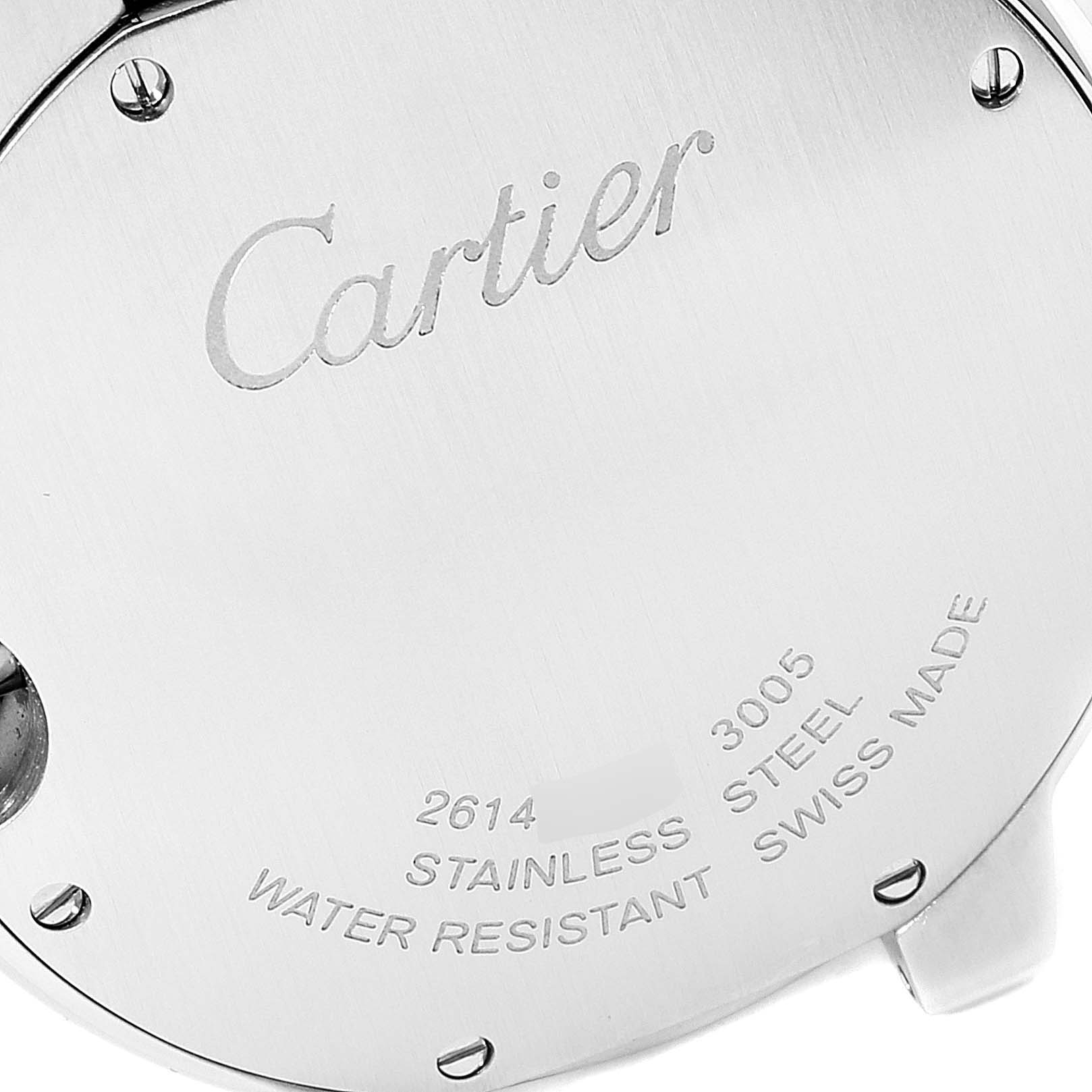 The image shows the case back of a Ballon Bleu model by Cartier, highlighting the brand engraving and specifications.