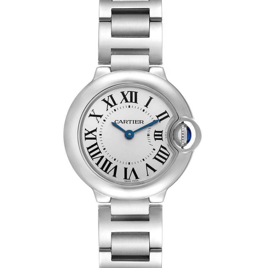 The Cartier Ballon Bleu watch is shown from a top-down angle, displaying the dial, Roman numerals, and metal bracelet.